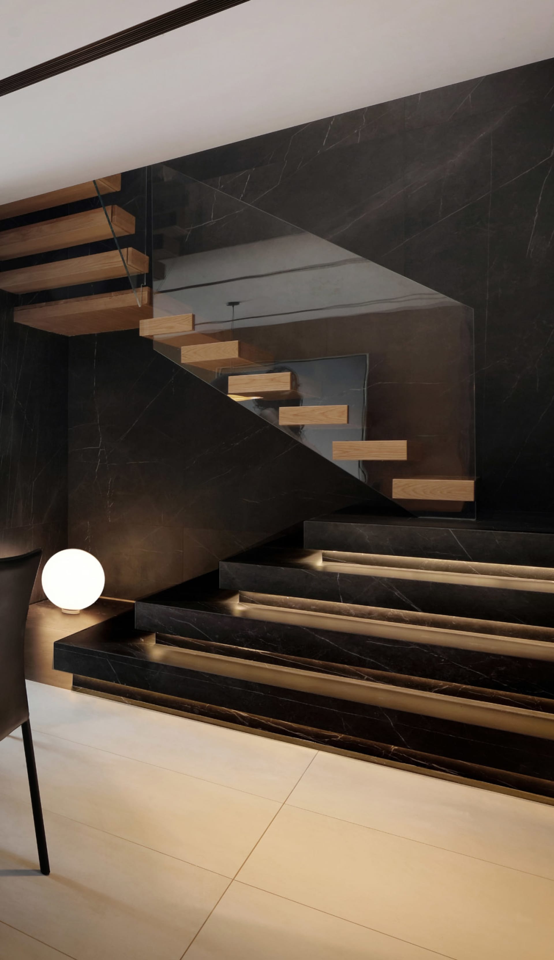A modern, minimalist staircase with dark marble stairs and light wooden treads and risers, illuminated by warm lighting.