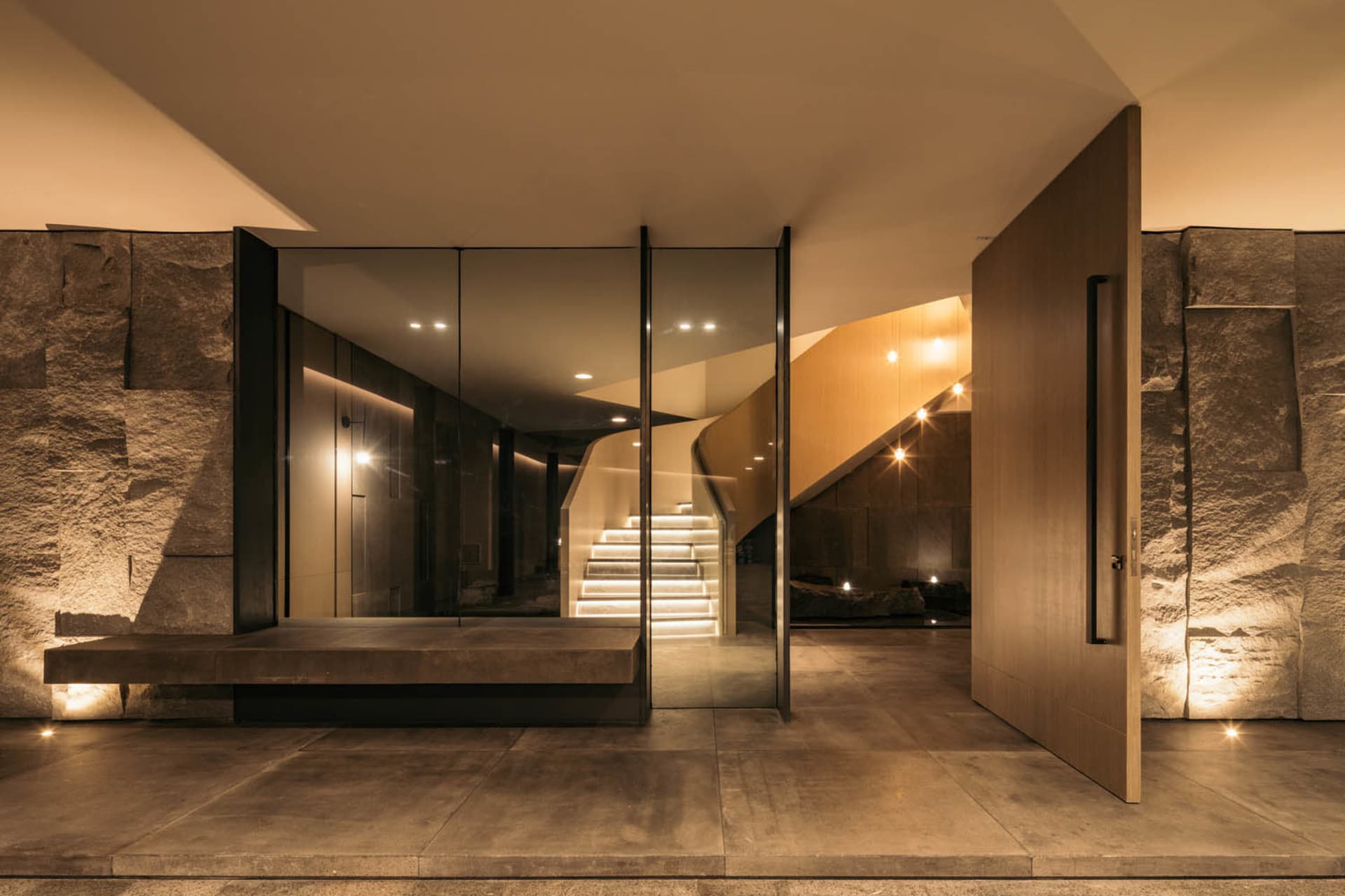 A modern interior space featuring concrete and wood materials.