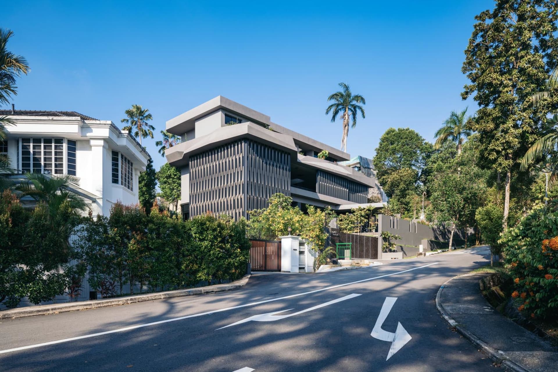 A modern residential home featuring a metal and glass exterior.