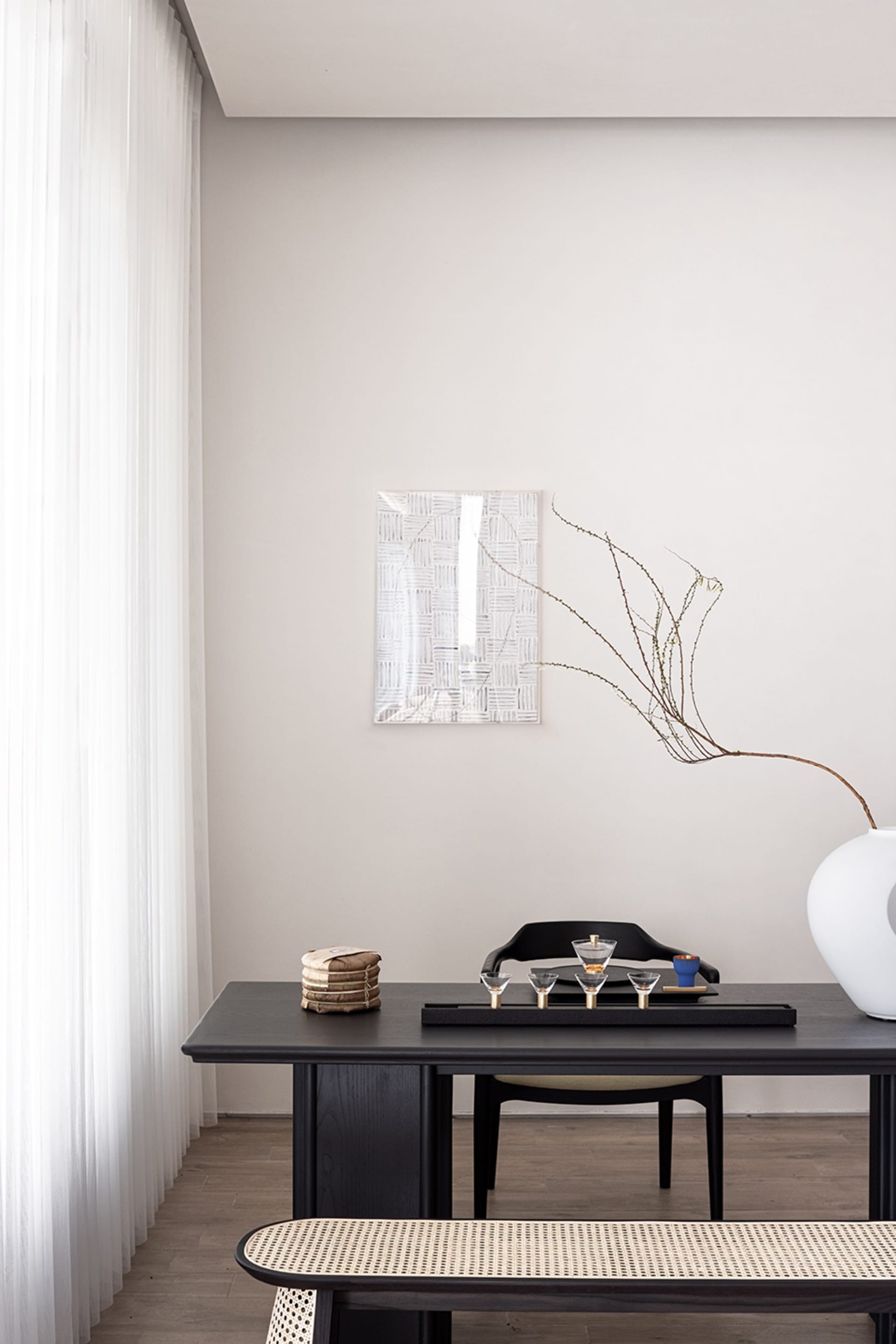 A modern black coffee table with a minimalist coffee table setting and minimalist decor. Minimalist home decor with black woo