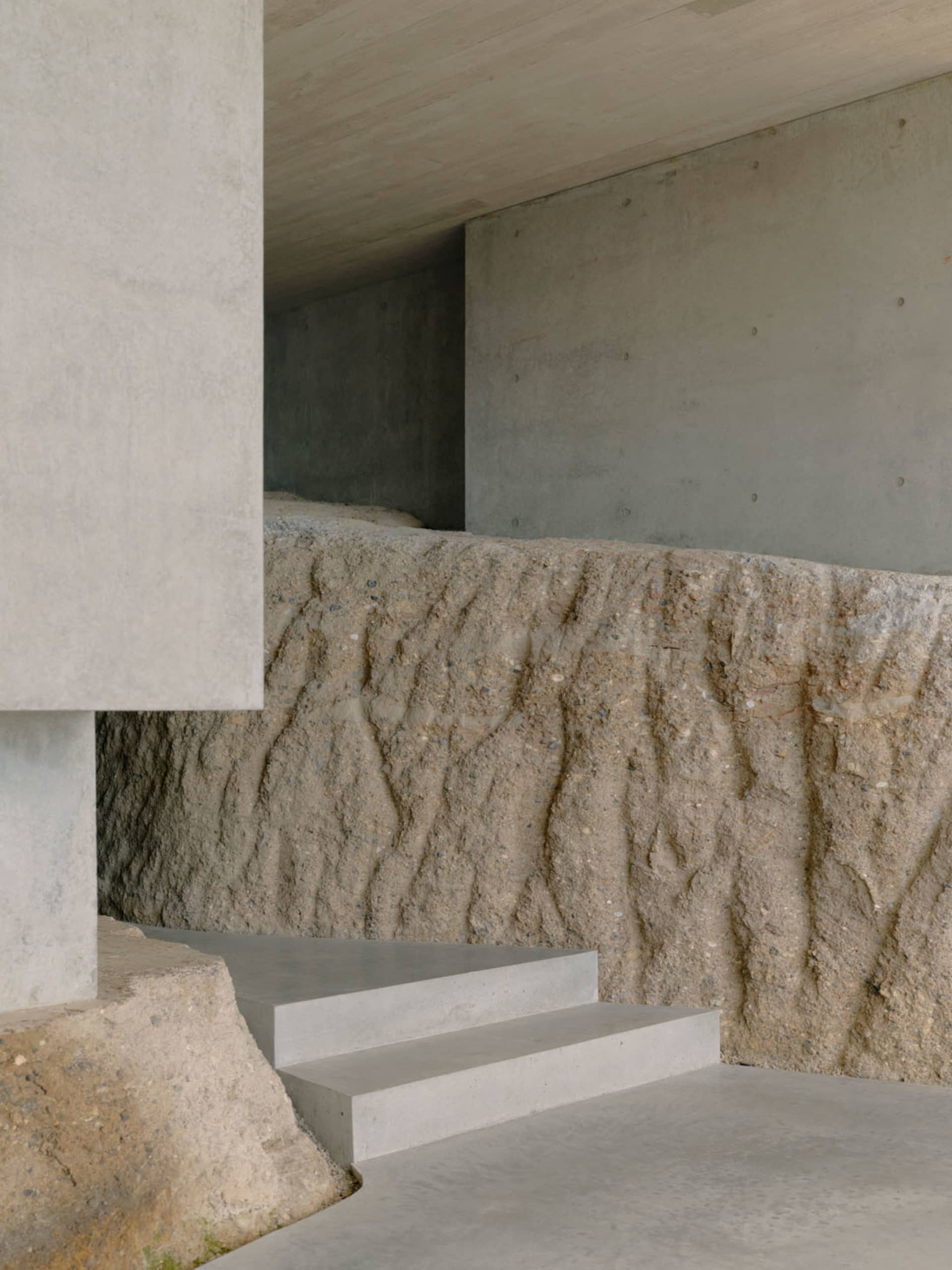 Concrete steps and walls in a modern interior design setting.
