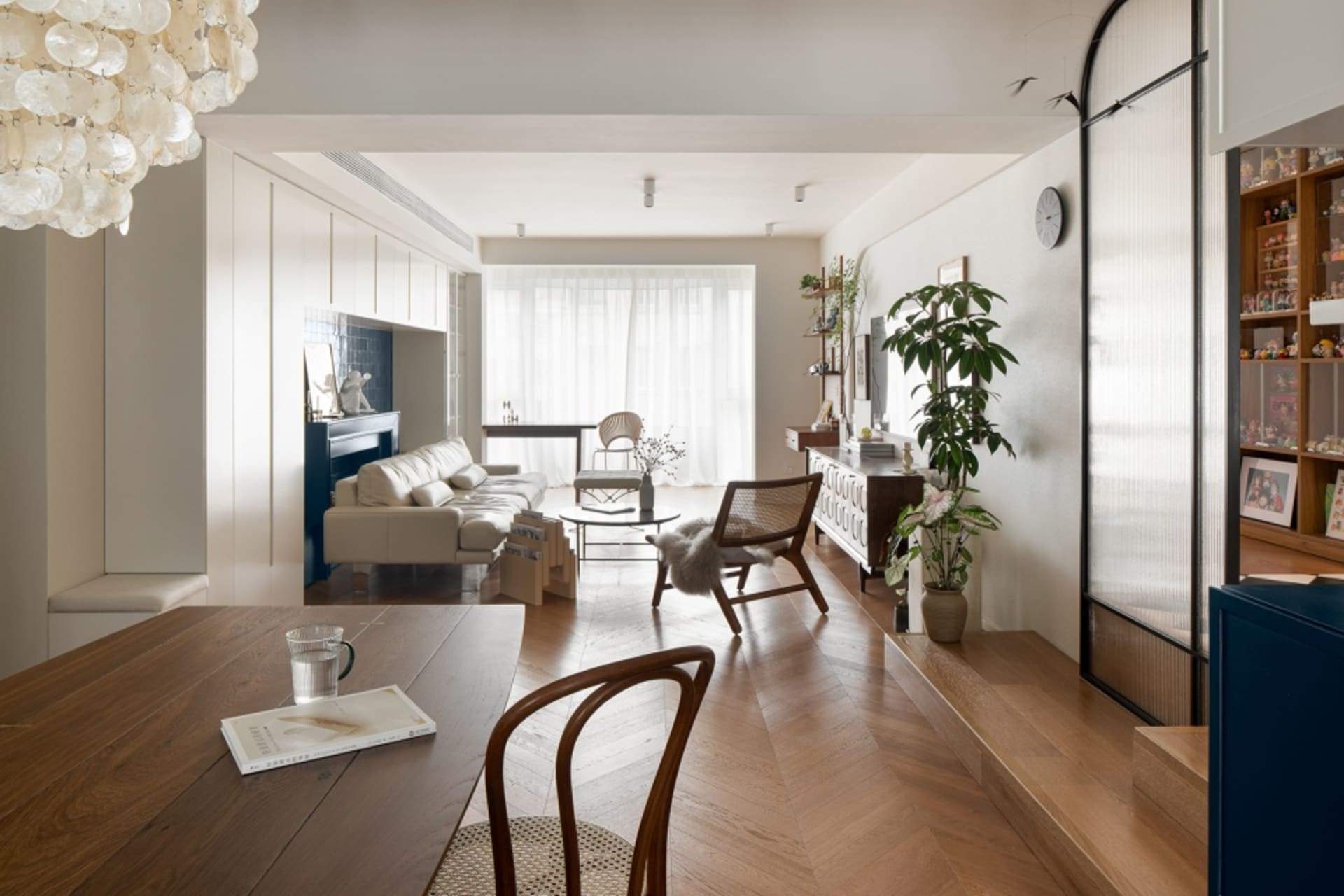 Contemporary living room featuring wooden furniture and fabric accents.