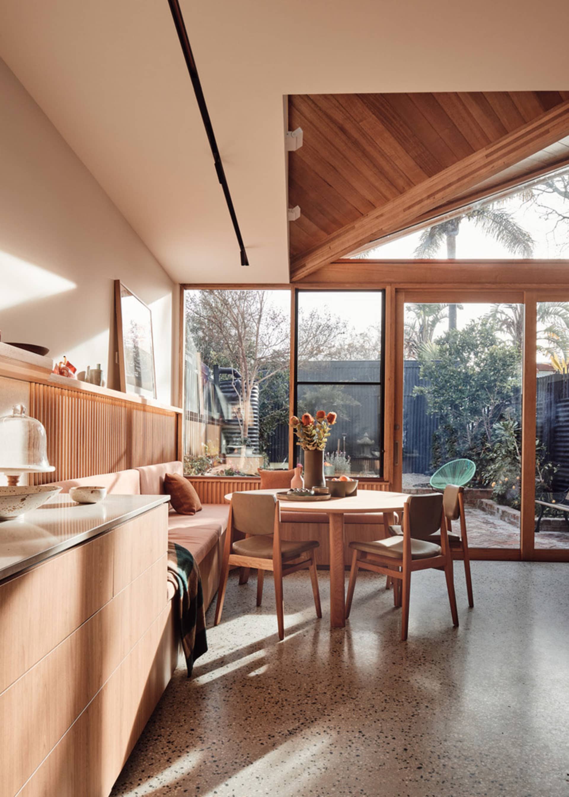 Modern kitchen and dining room featuring a terrazzo-tiled floor