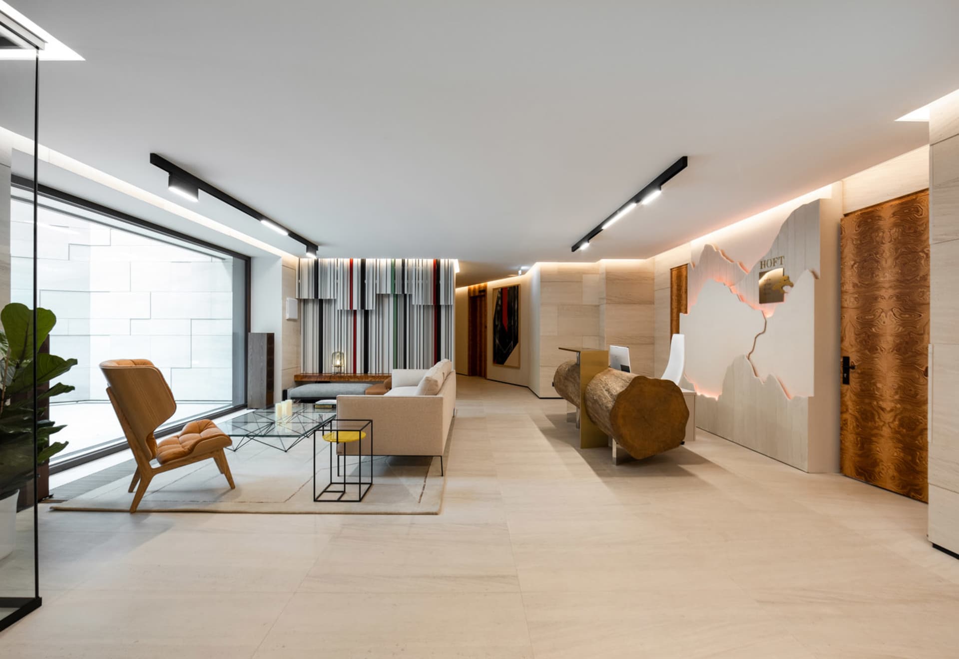 Modern industrial lobby featuring concrete and wooden elements
