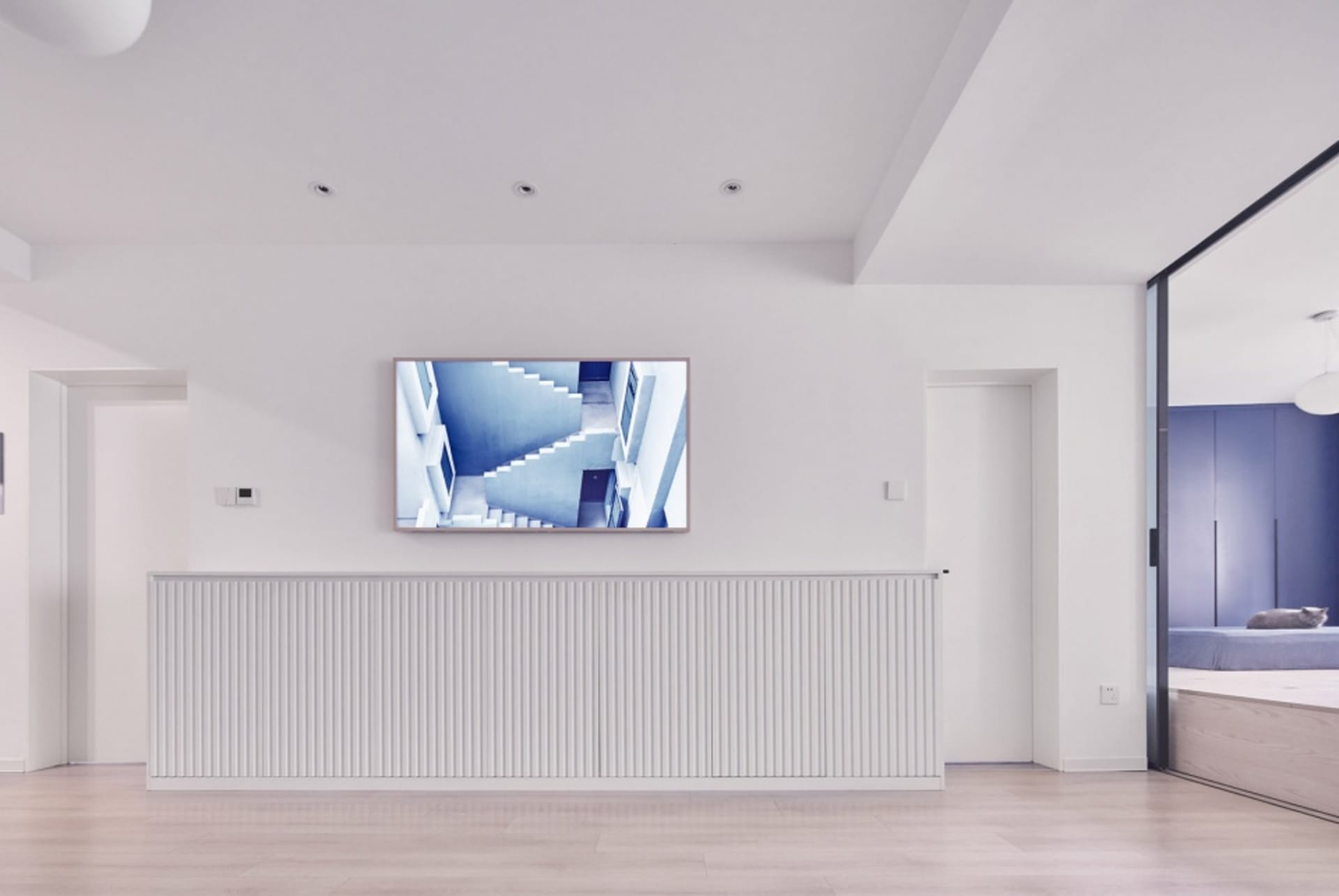 Minimalist white staircase in an interior design setting.