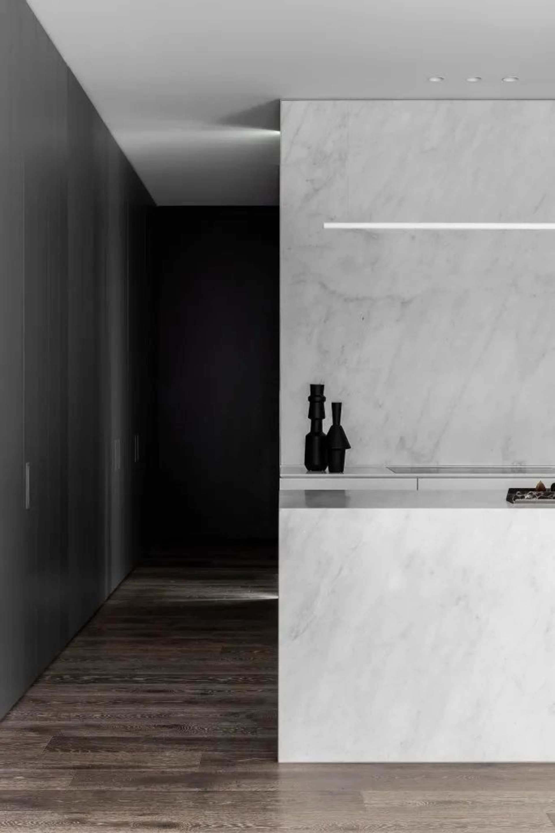 Modern minimalist kitchen with marble countertops and white marble backsplash