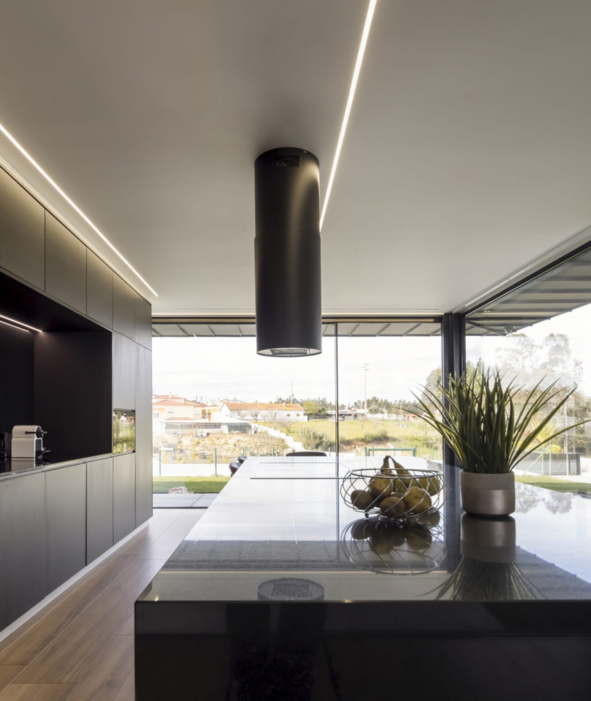 Contemporary kitchen interior with black and white design elements.