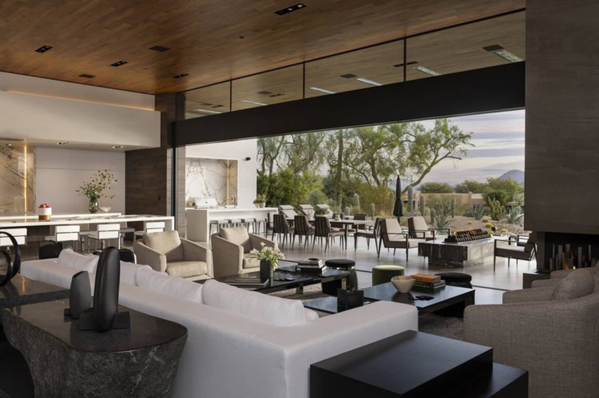 Modern living room with concrete, wood, and glass materials