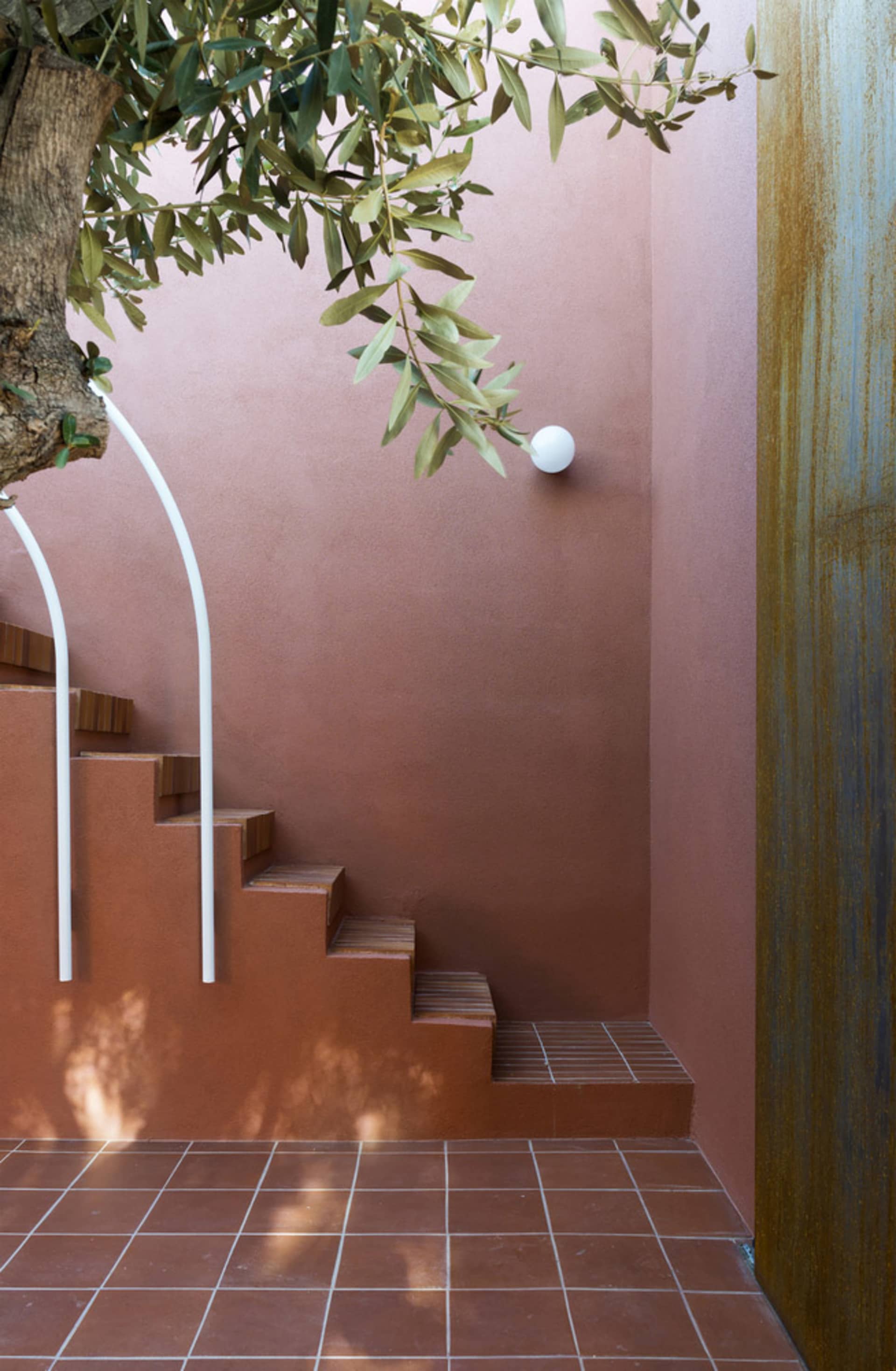 Concrete staircase with minimalist design in modern entryway.