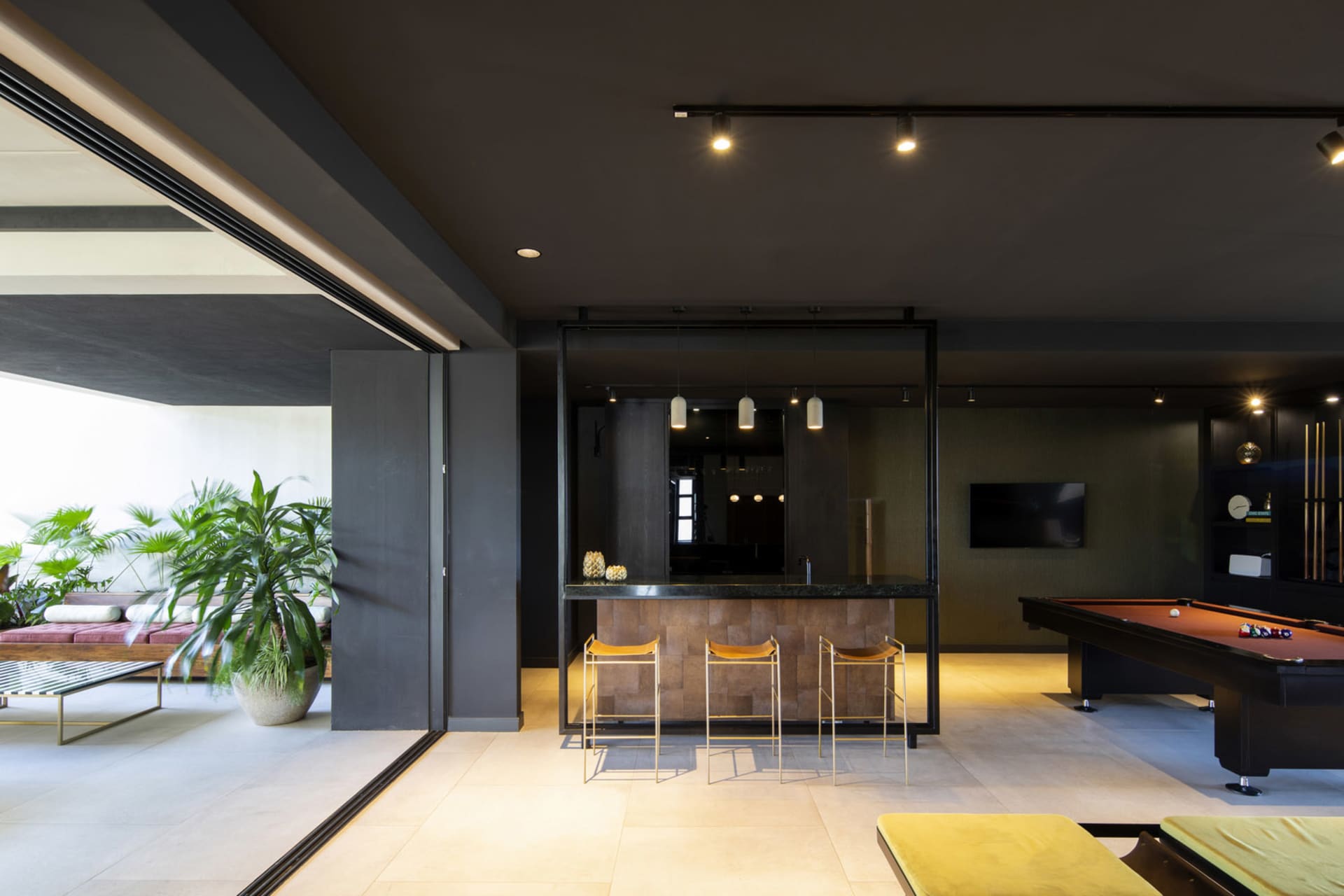 A modern living room features a combination of wood and stone materials.