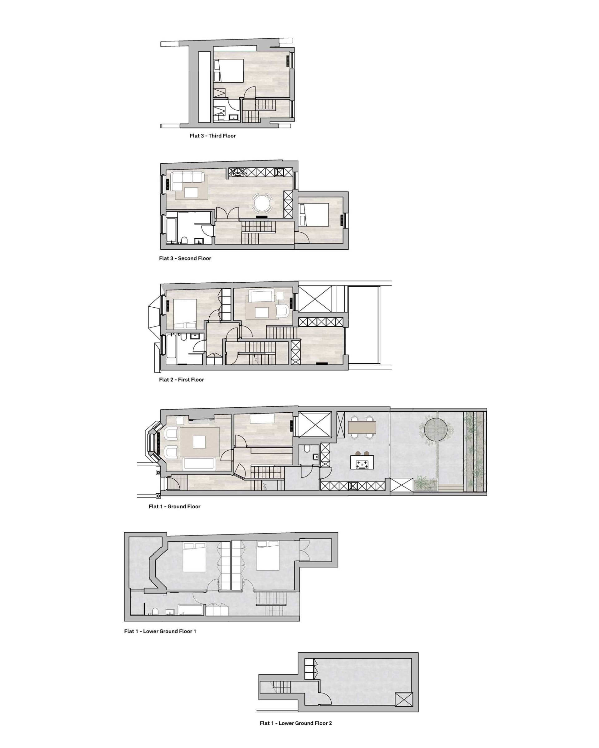 Detailed floor plans of a residential house in paper format, including different levels and rooms.