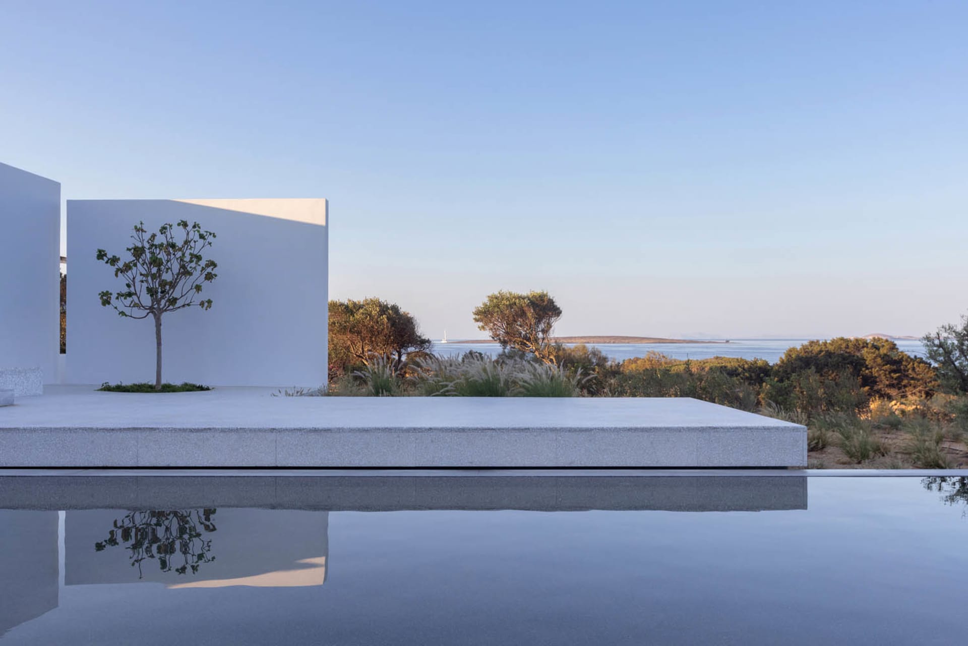 Modern residential exterior featuring sleek lines and large glass panels