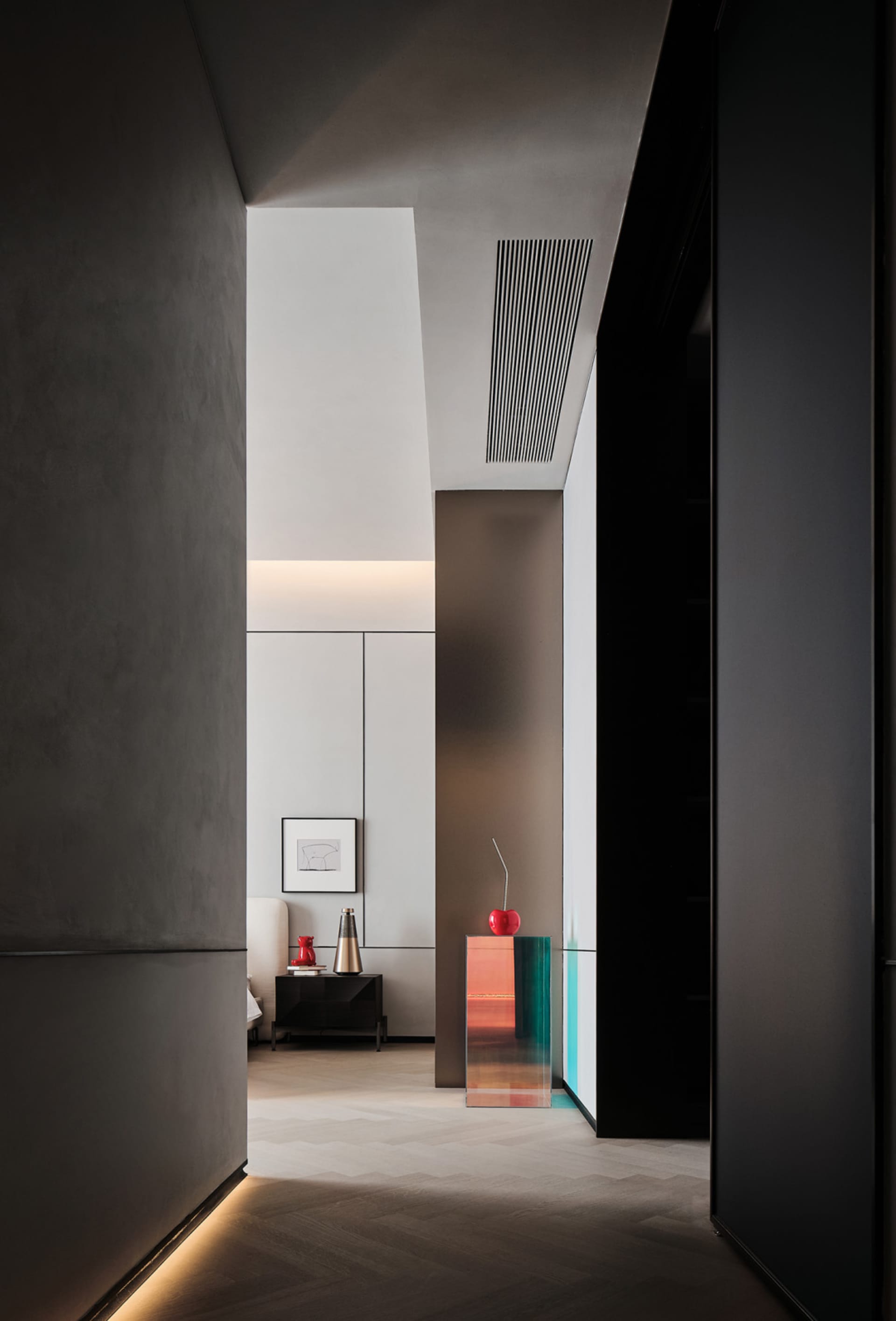 A minimalist bedroom with concrete and glass elements.