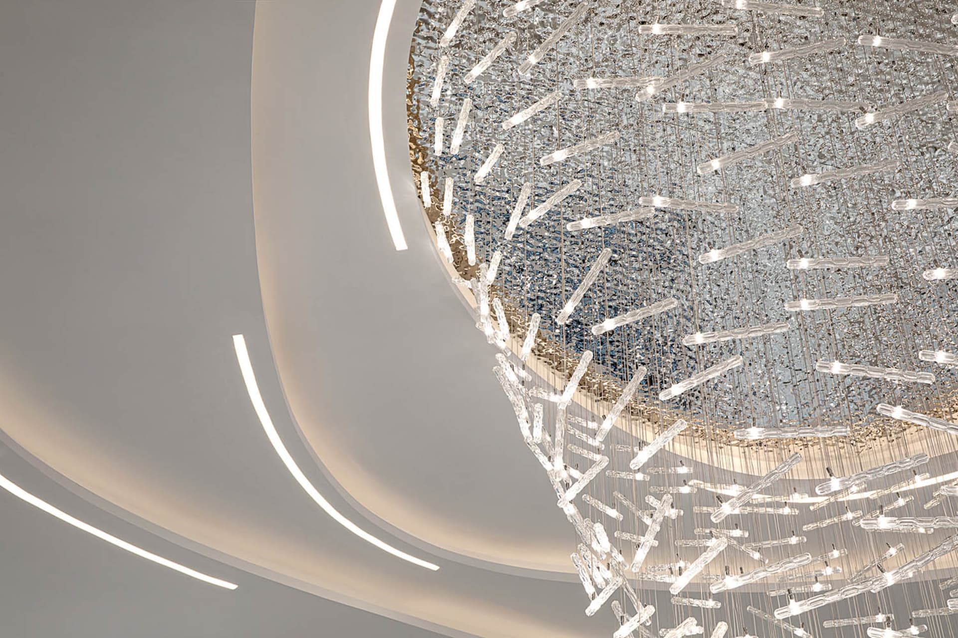 A modern, minimalist interior with a glass ceiling featuring a contemporary, artistic design.