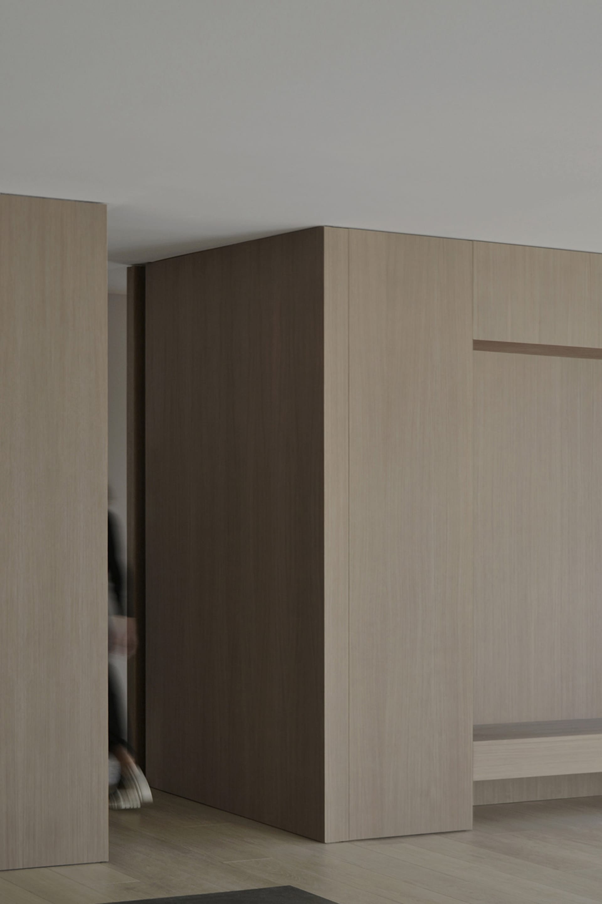 A minimalist indoor space featuring wooden panels.