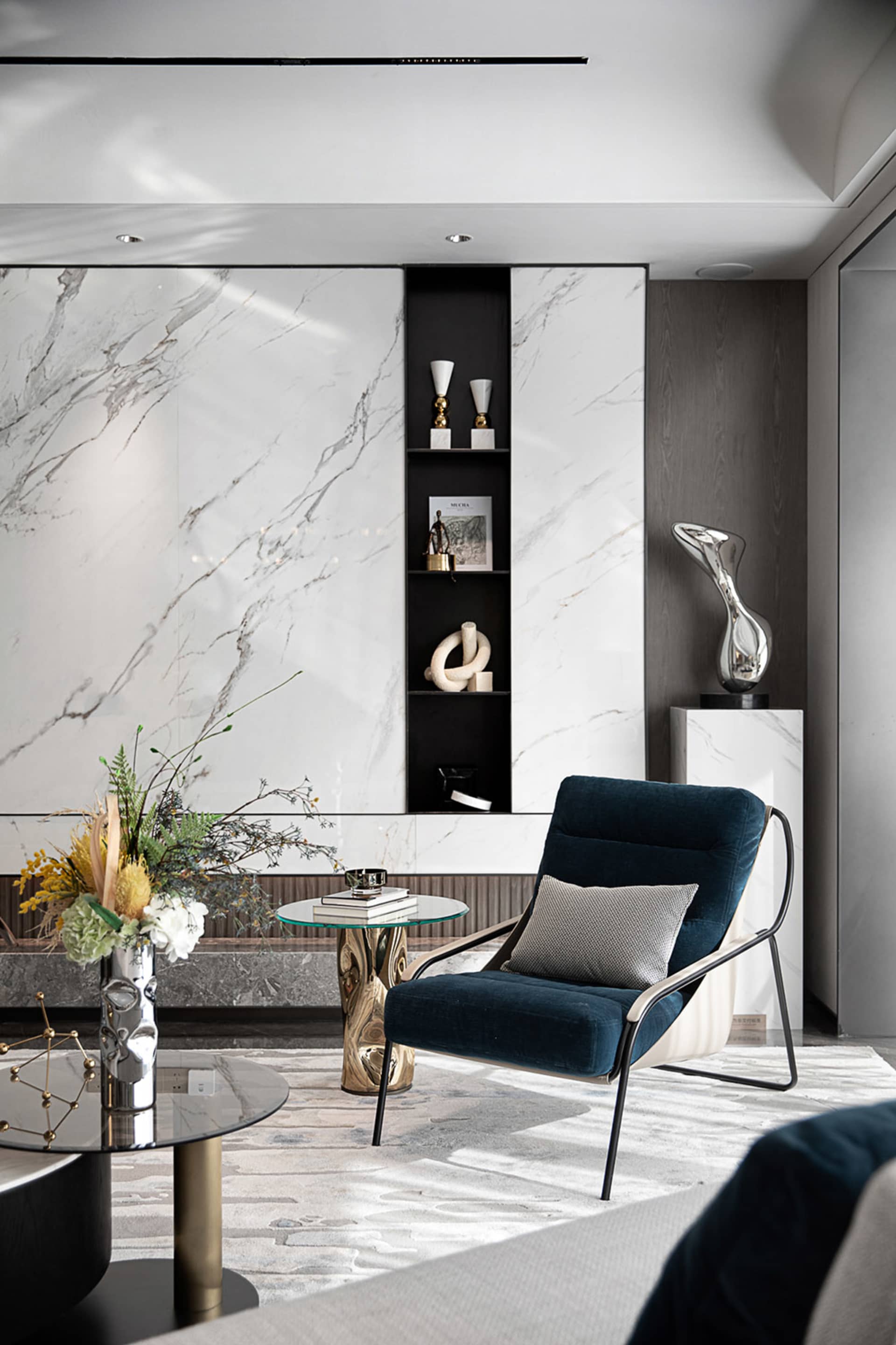 Modern living room with marble walls and wood accents