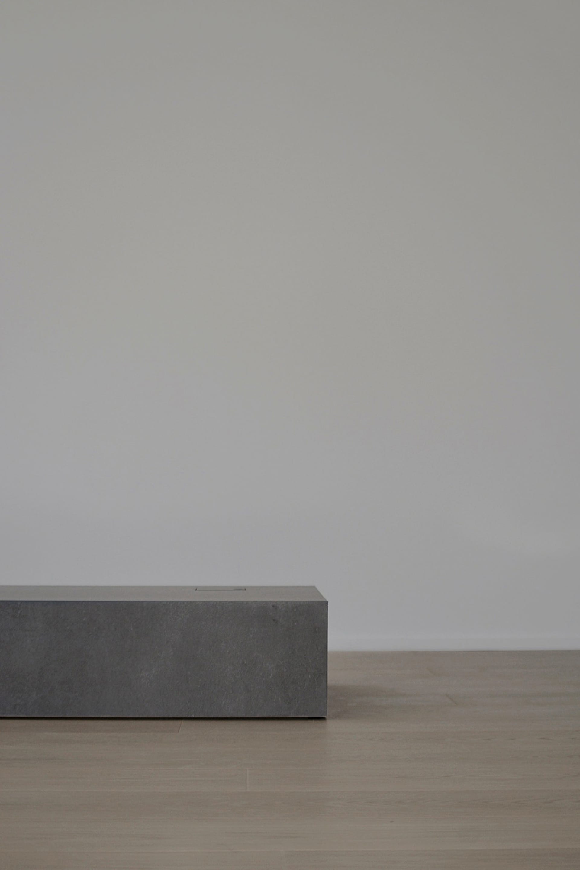A minimalist furniture piece crafted from concrete.