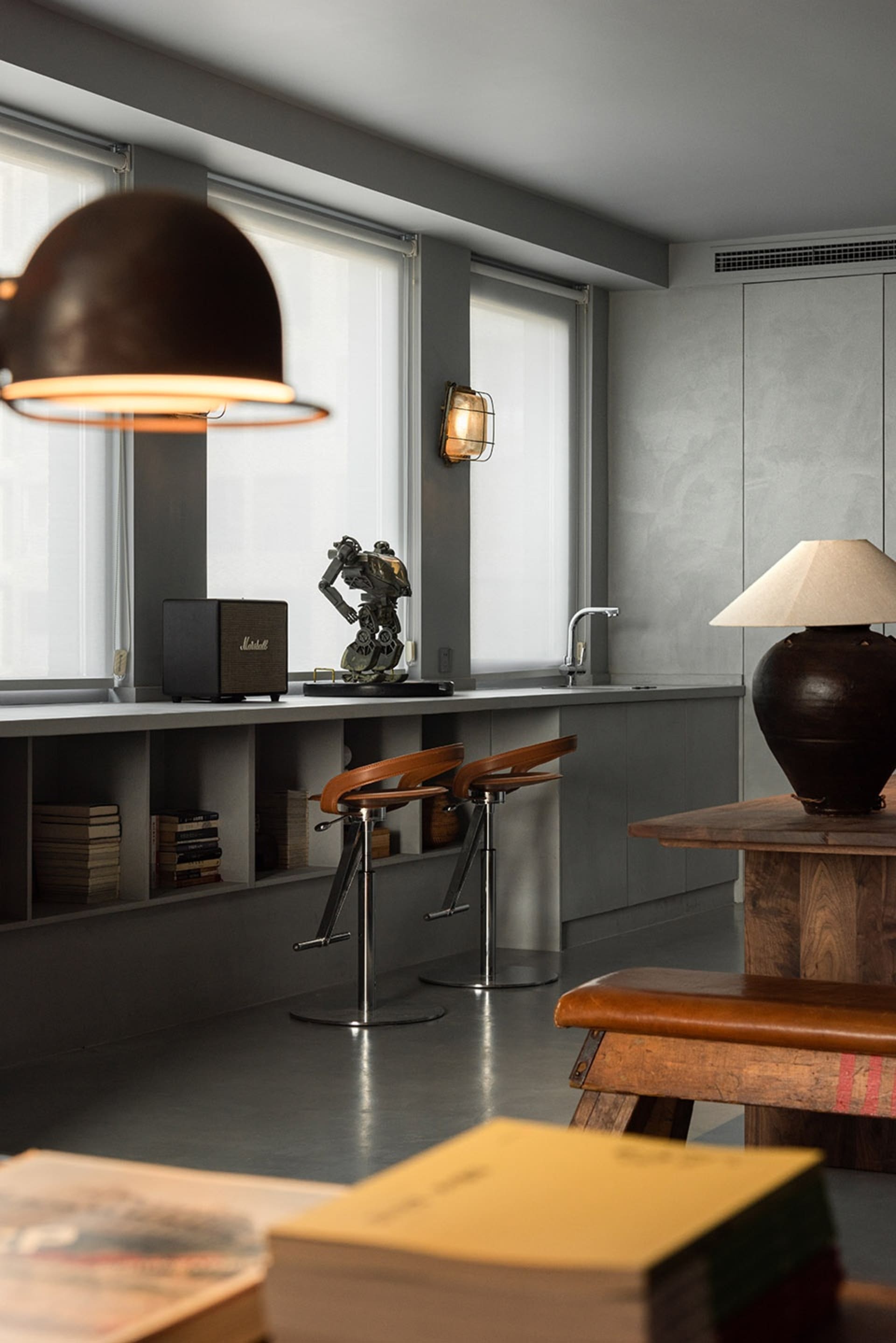 Living room interior with mixed media furniture and industrial accents