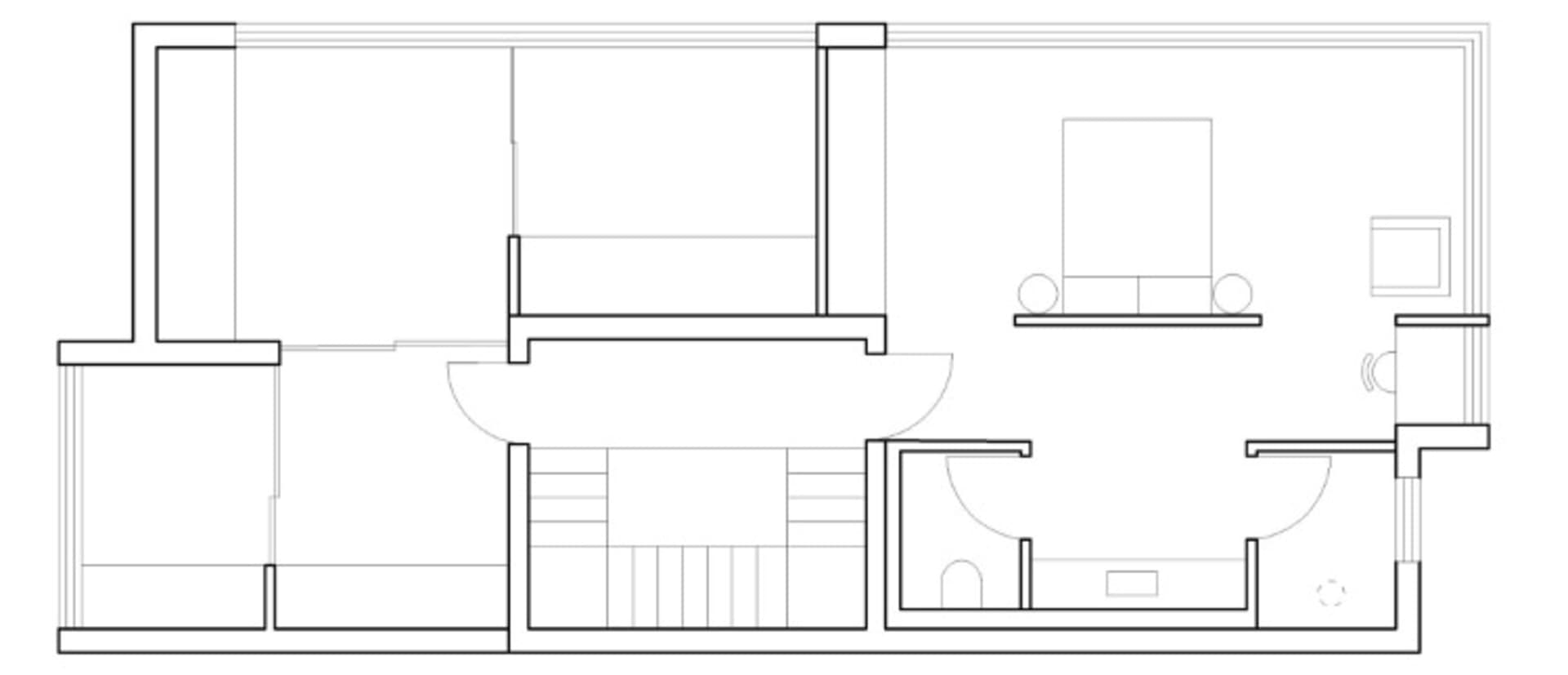 Floor plan of a minimalist residential layout depicting a living area with a couch and table, a bedroom with a bed, and a bat