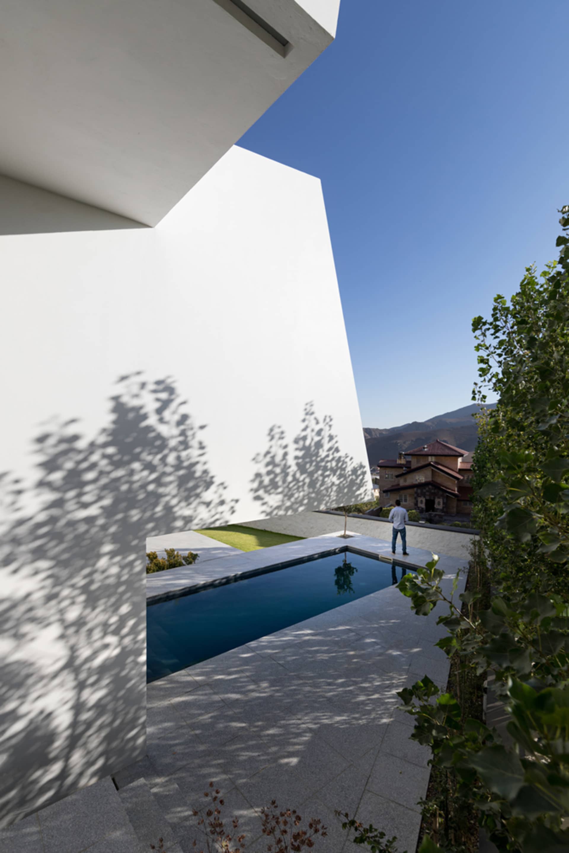 A modern architectural space featuring a concrete structure and minimalistic design.