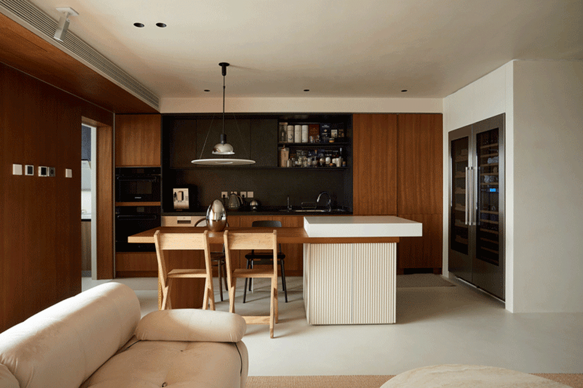 Modern residential kitchen with wooden and laminate finishes.