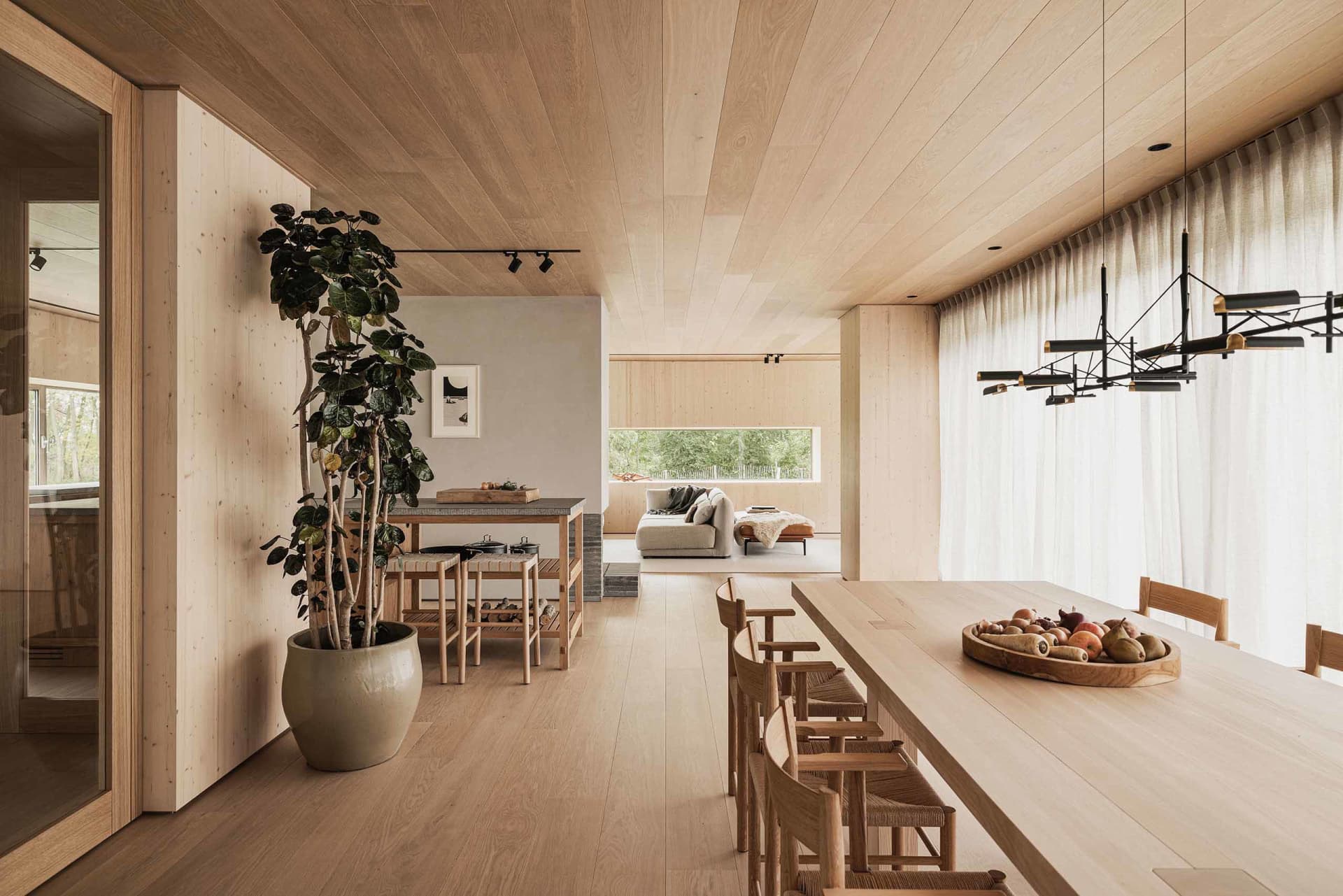 Modern residential interior design with wood materials and a minimalistic approach.