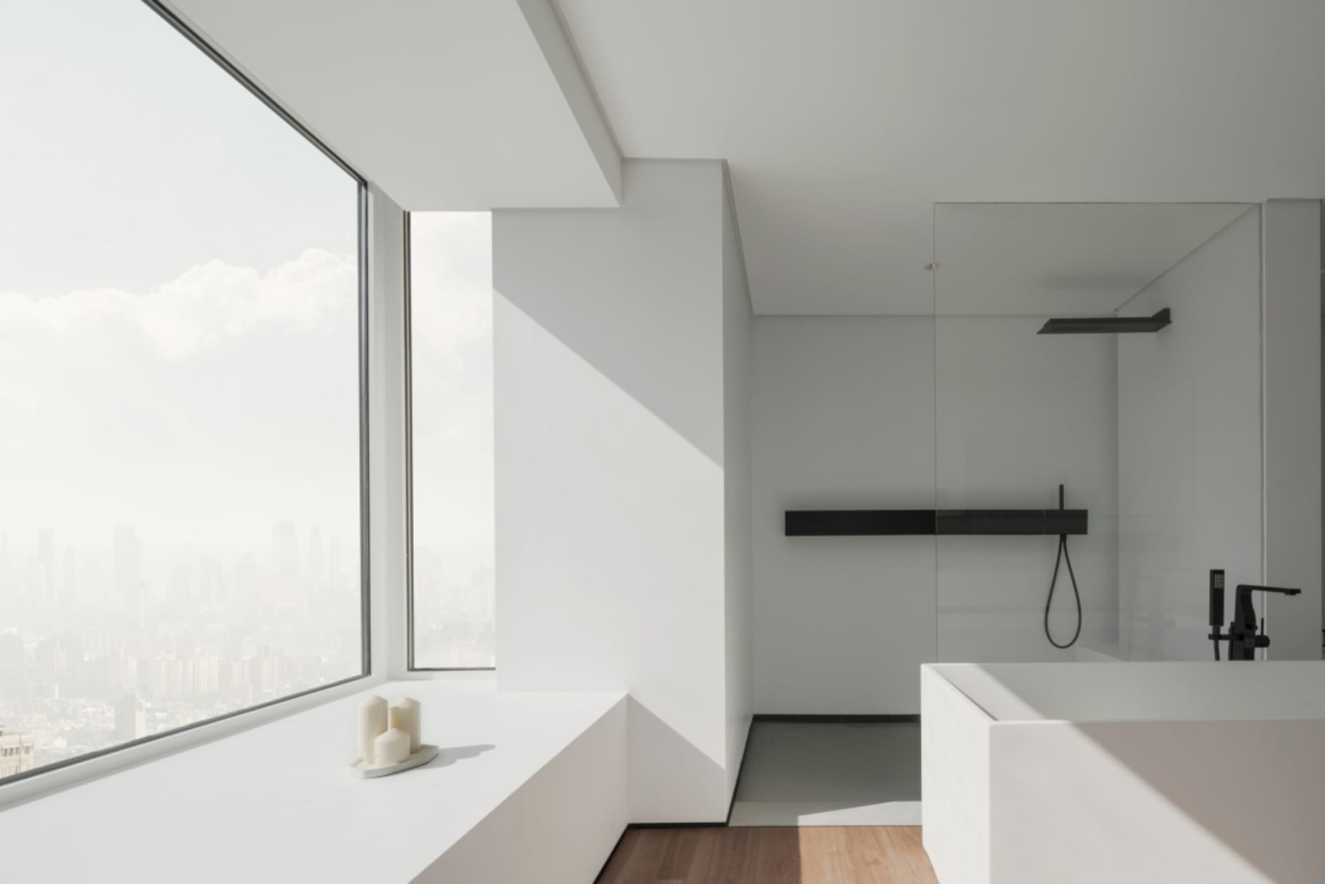Minimalist bathroom featuring concrete walls and glass shower enclosure