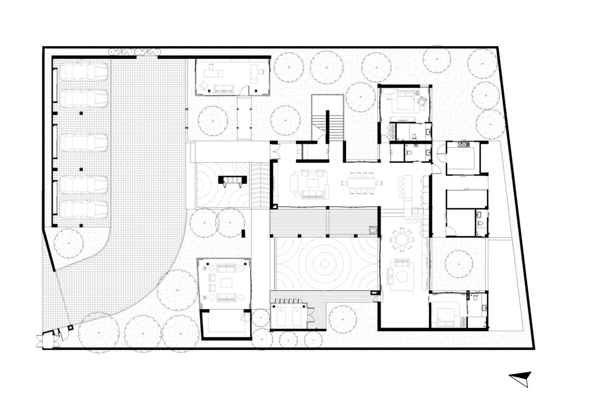 Modern residential floor plan showing living, dining, kitchen, and bedroom areas with a central staircase and outdoor garden