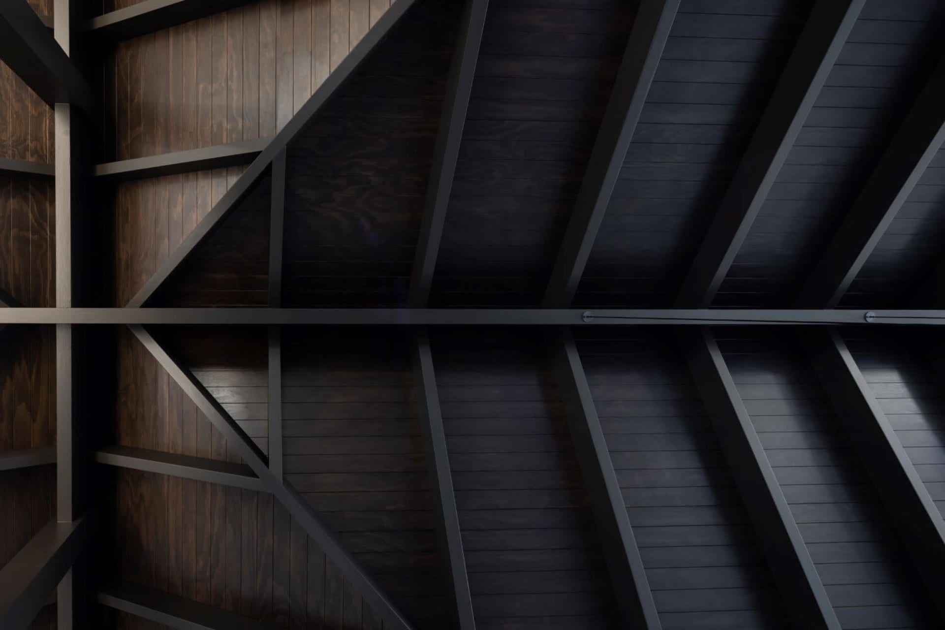 Ceiling with industrial steel beams and wooden panels