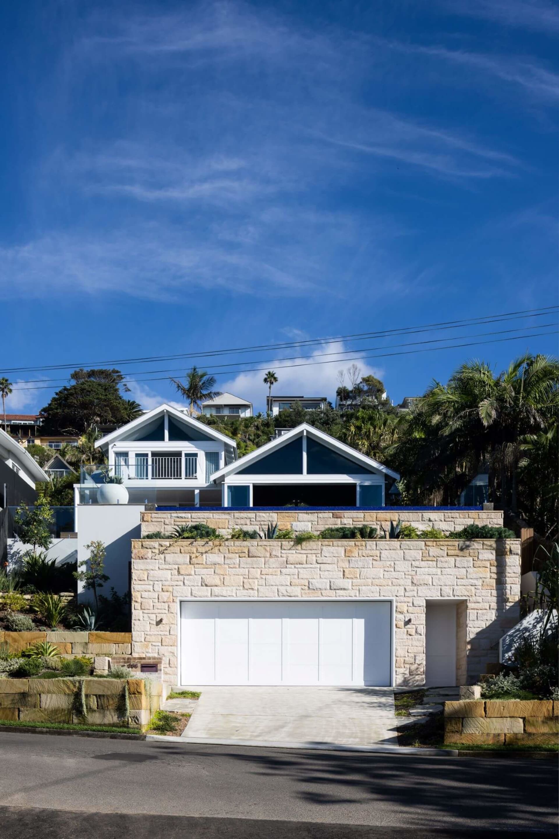 Modern house with stone brick facade and garage.