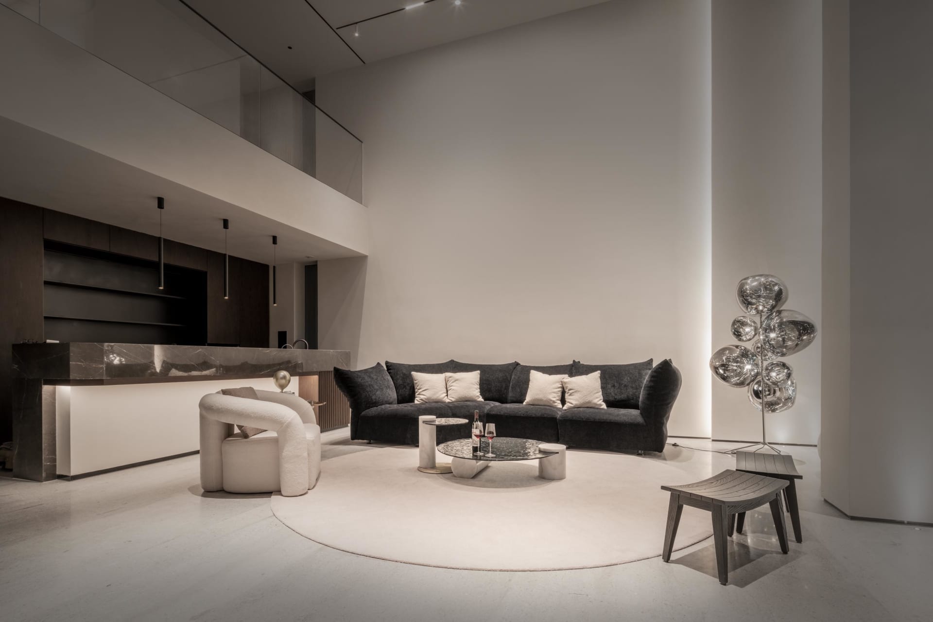 Modern living room featuring marble and metal materials.