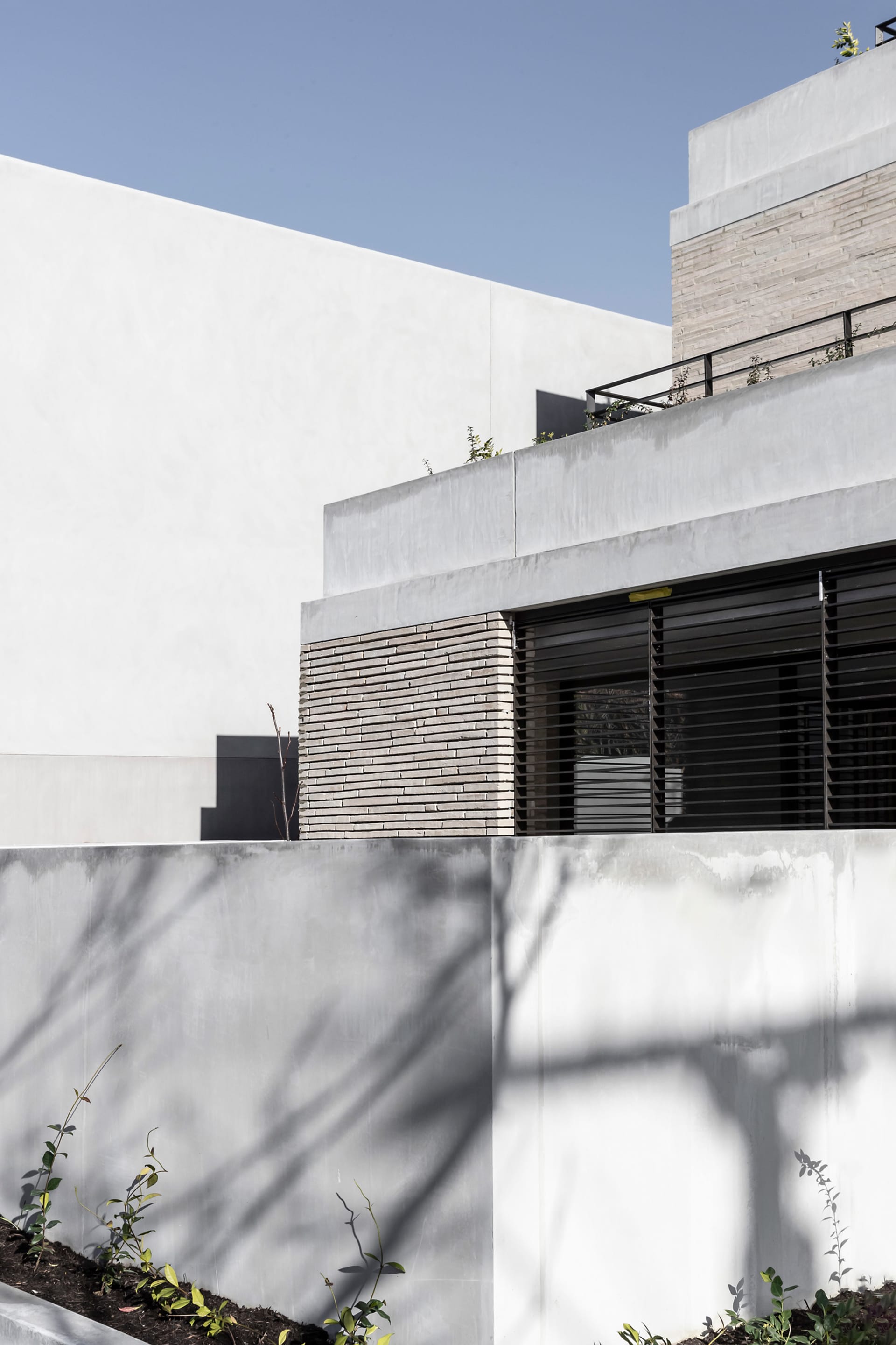 The image showcases a modern building made of concrete.