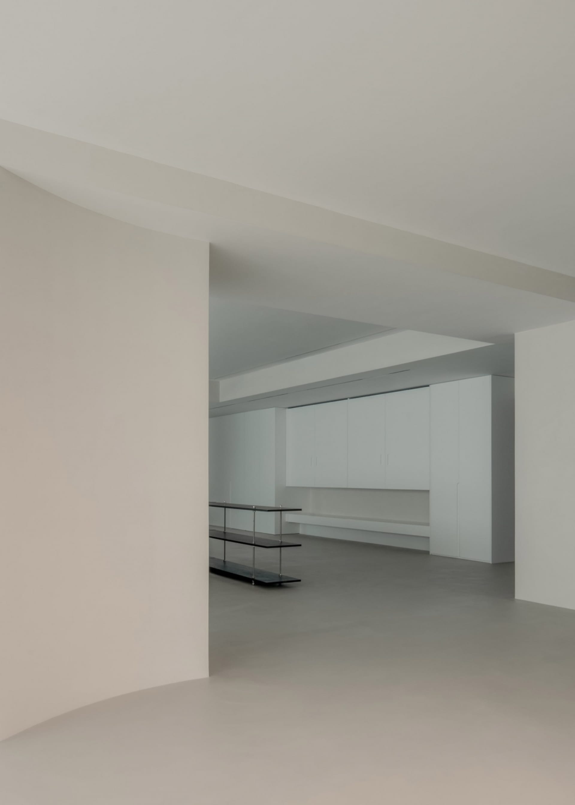 A modern interior space featuring concrete finishes.