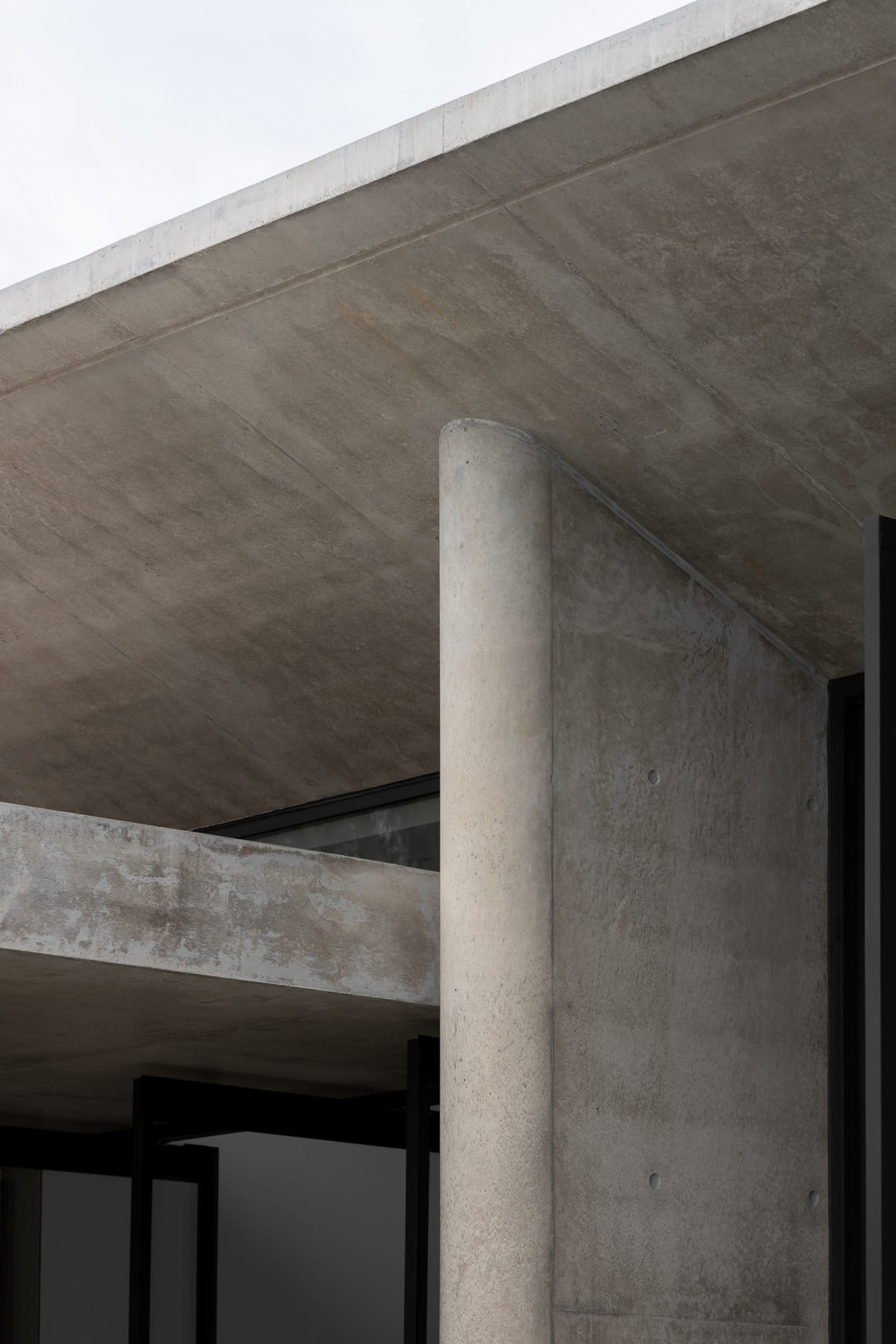 Modern, contemporary architectural design featuring a concrete exterior with clean lines and minimalist style.