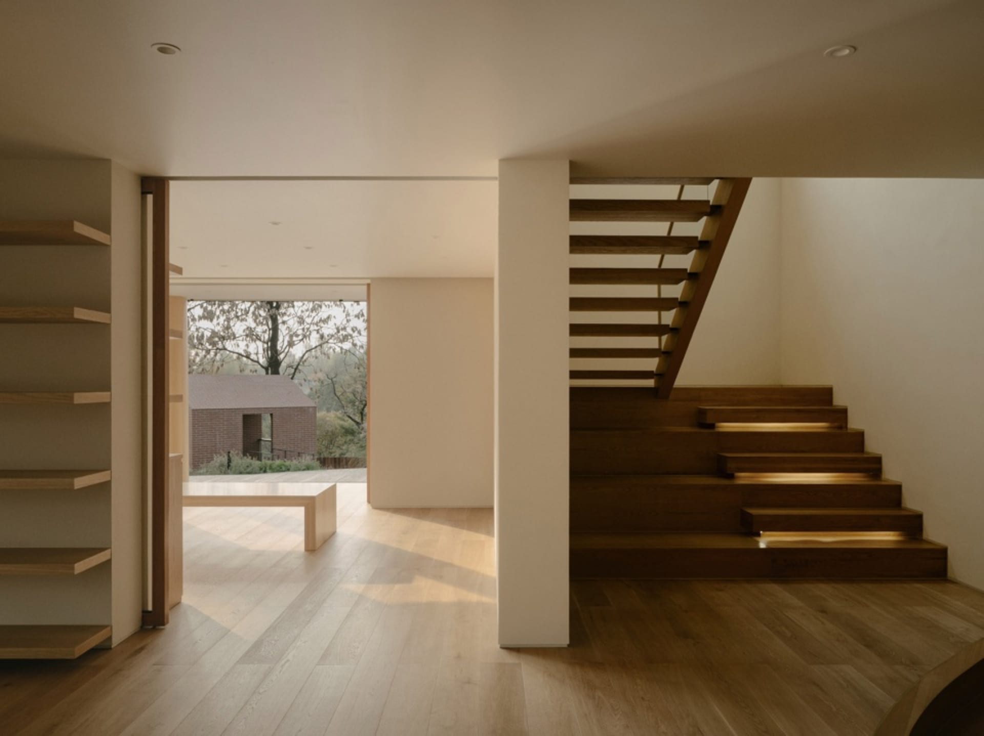 Modern residential interior with a wooden staircase