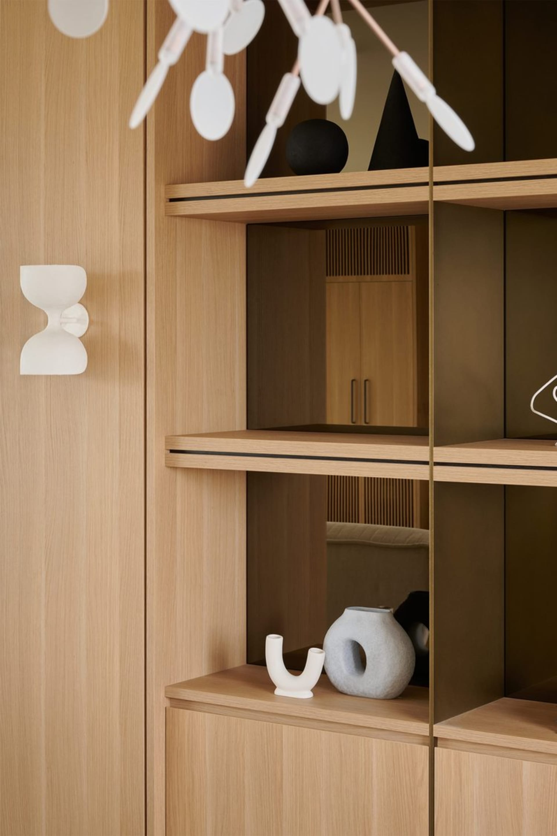 Modern wood shelves with minimalist design and storage features.