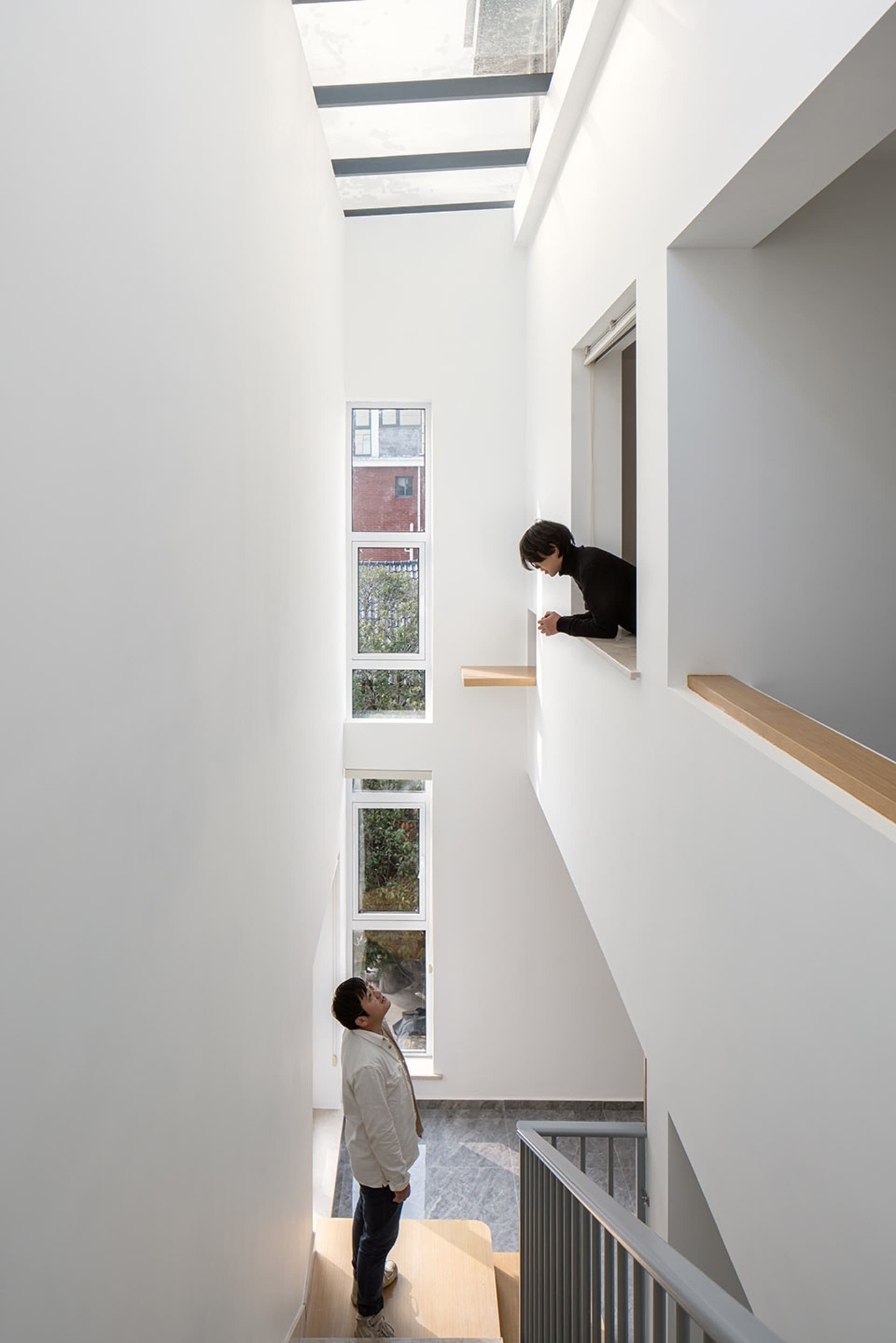 Modern indoor design featuring glass panels with glass lighting fixtures.