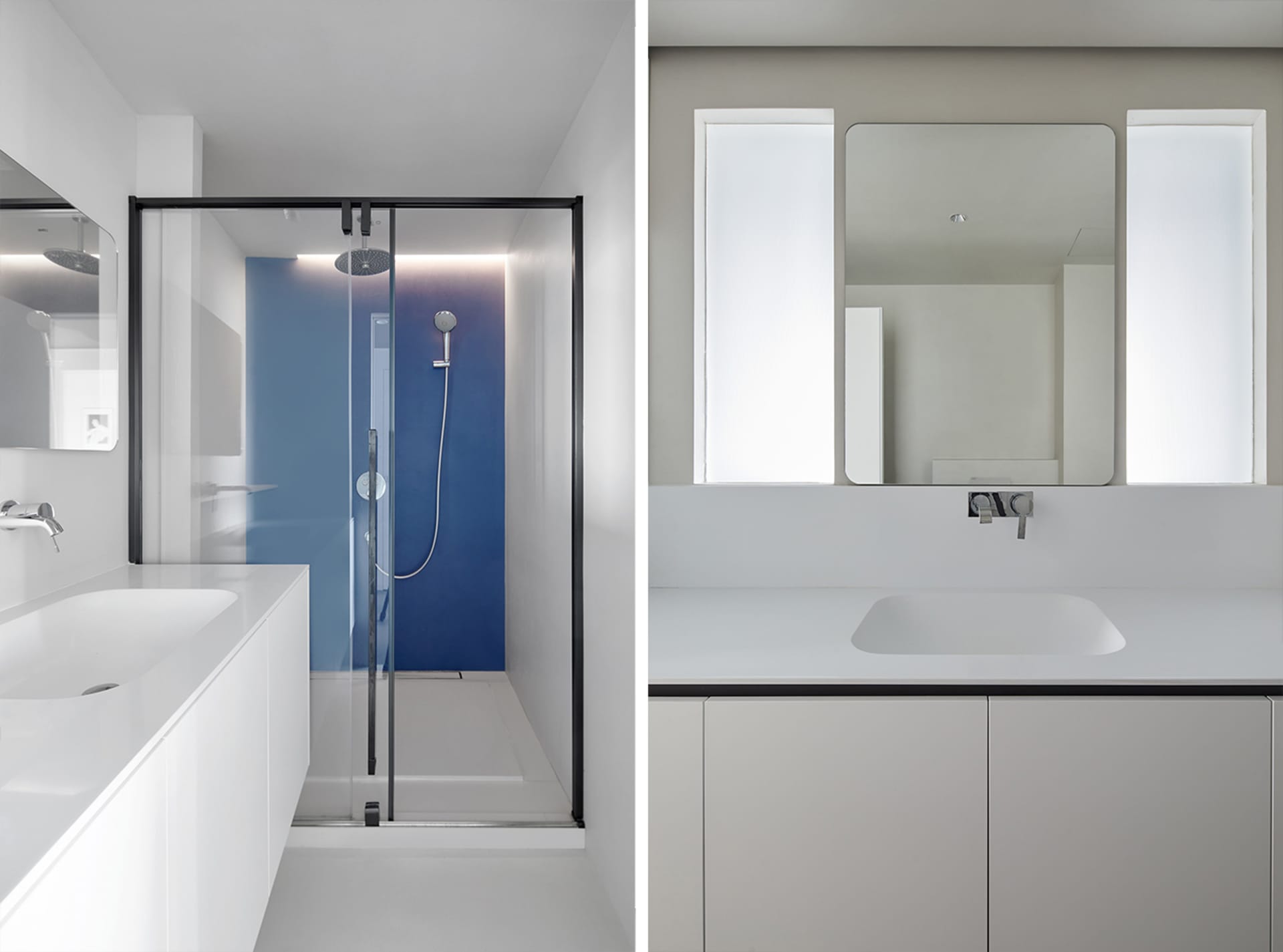 Minimalist bathroom with white and gray color scheme and glass shower enclosure.