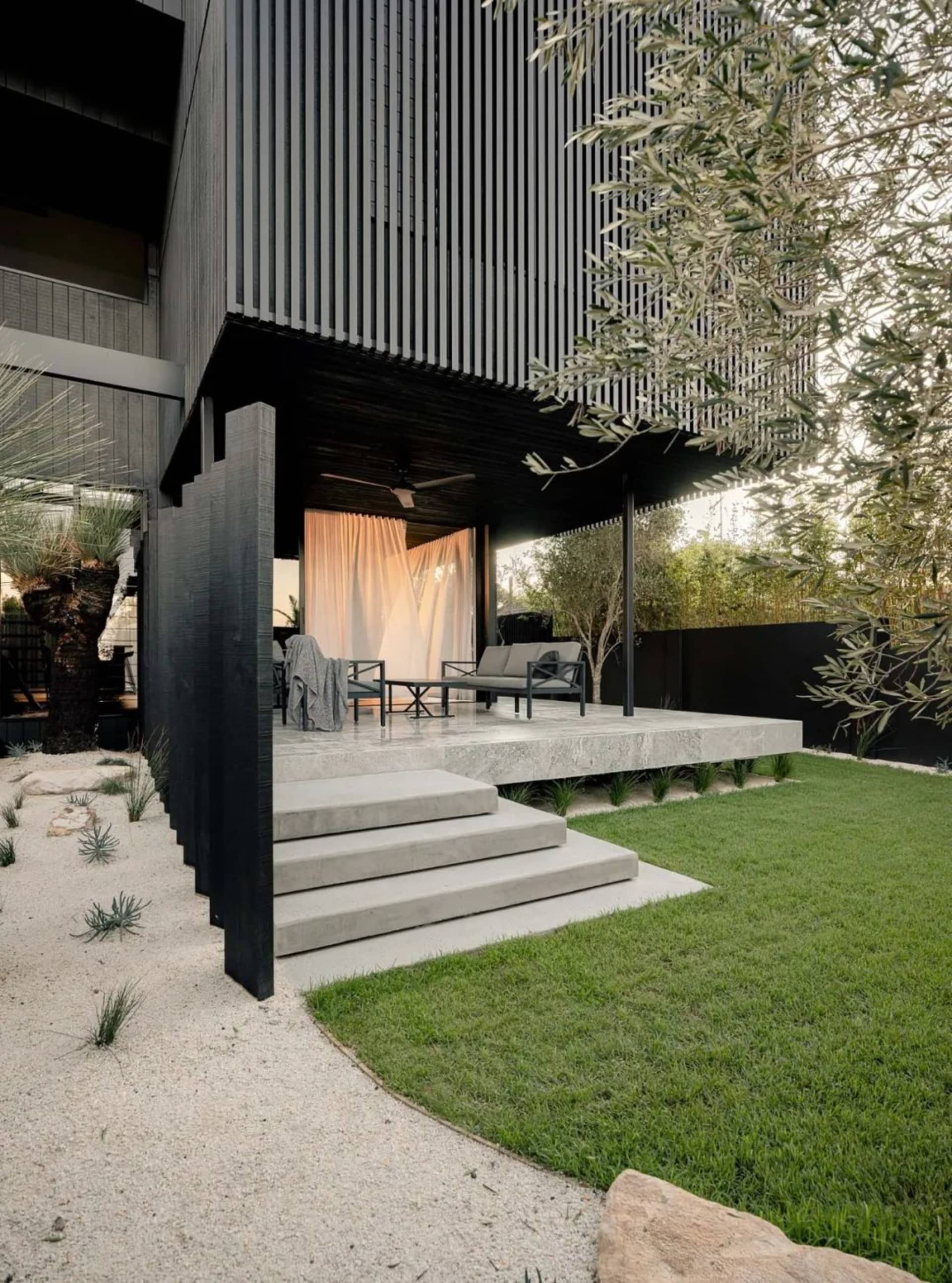 Modern style exterior design featuring a sleek, concrete structure with a minimalist aesthetic, showcasing clean lines and op