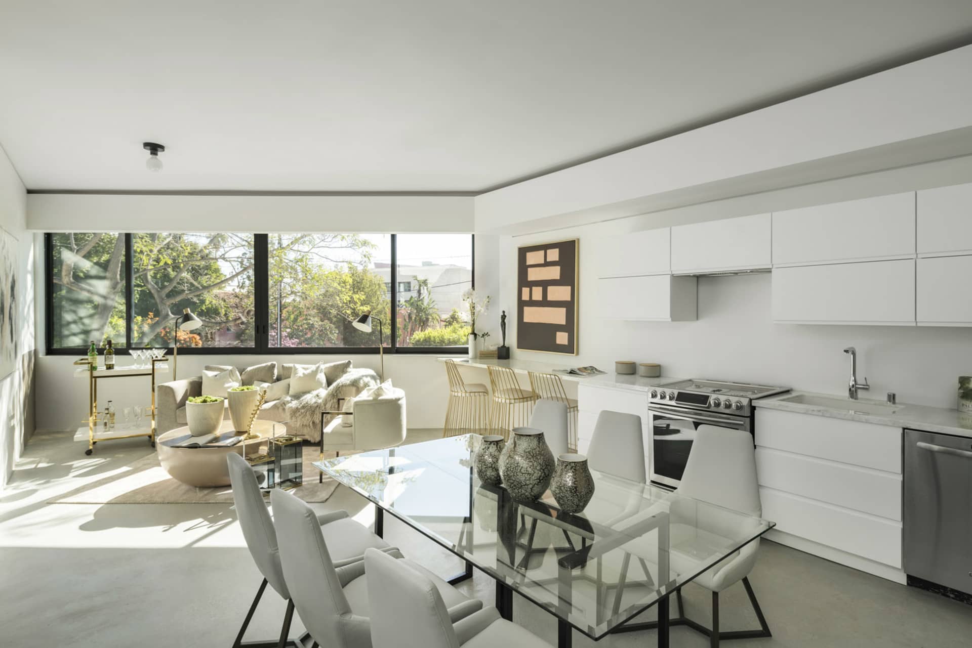 Modern residential kitchen designed with white materials.