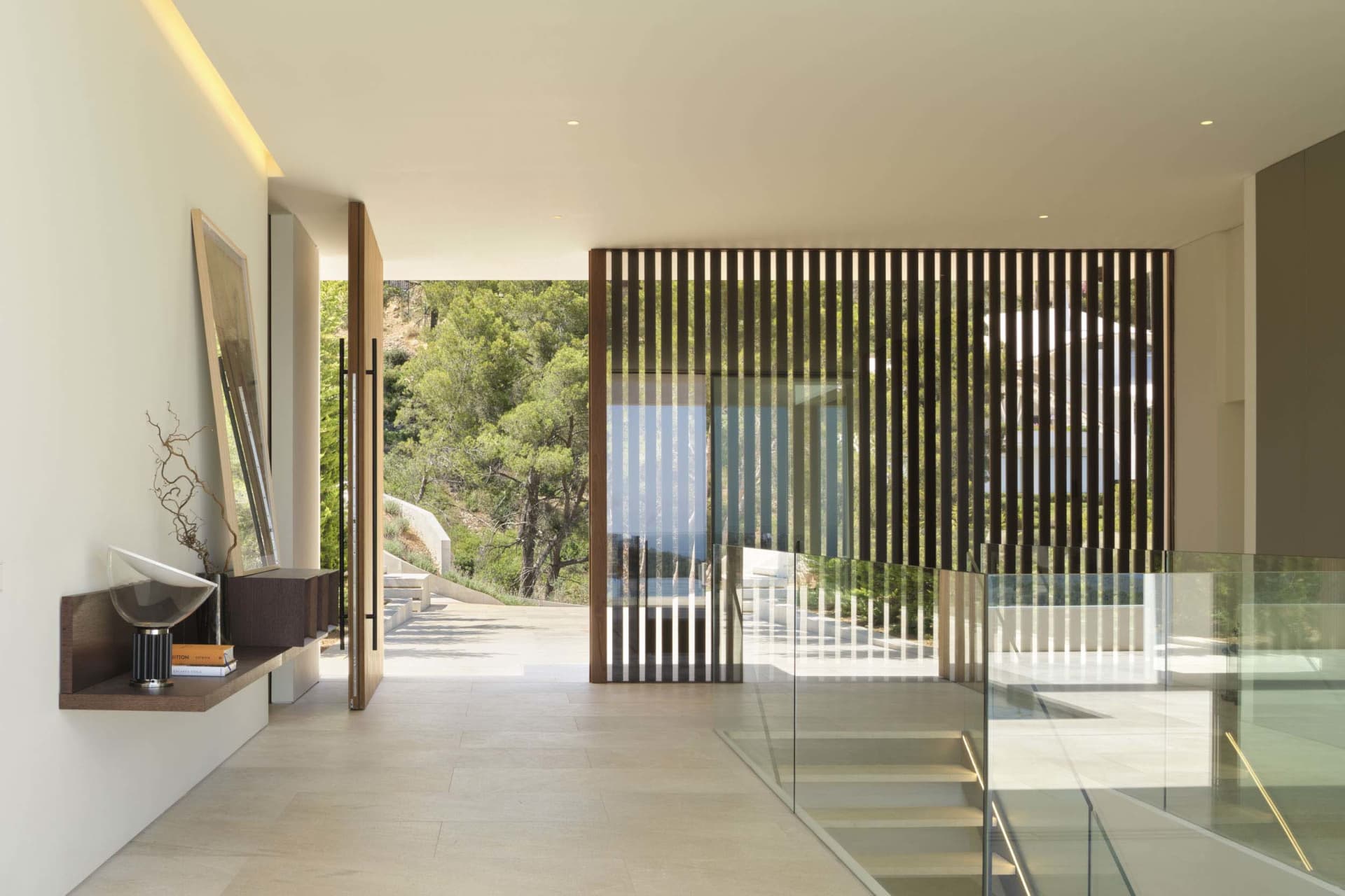 Contemporary interior design featuring glass window and minimalist decor.