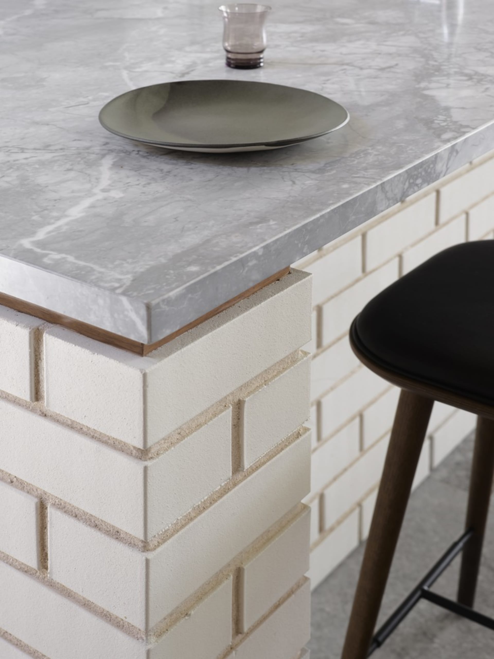 A sleek, modern kitchen counter featuring a marble surface.
