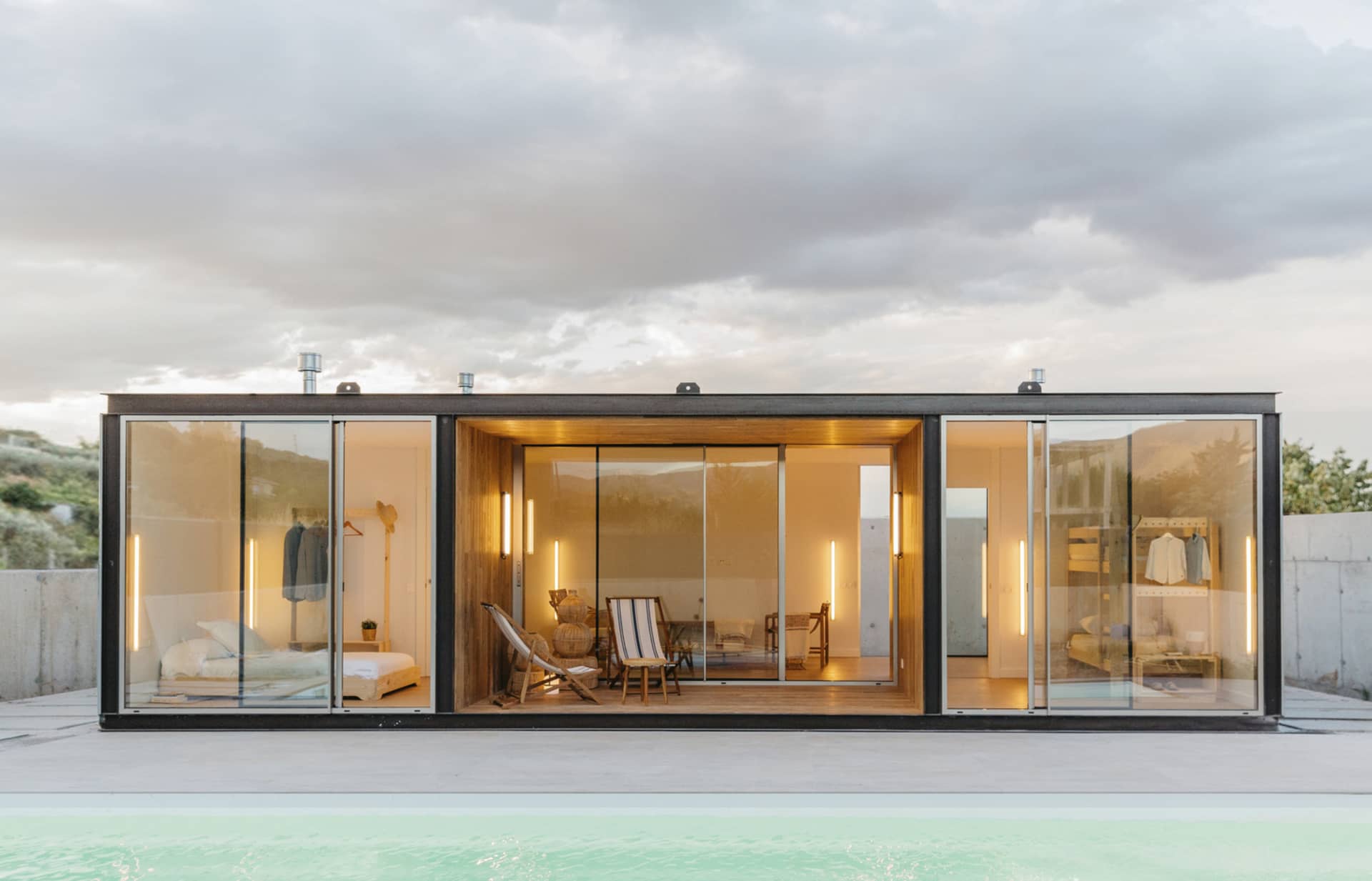 Modern minimalist residential house with a wood, glass, and concrete exterior.
