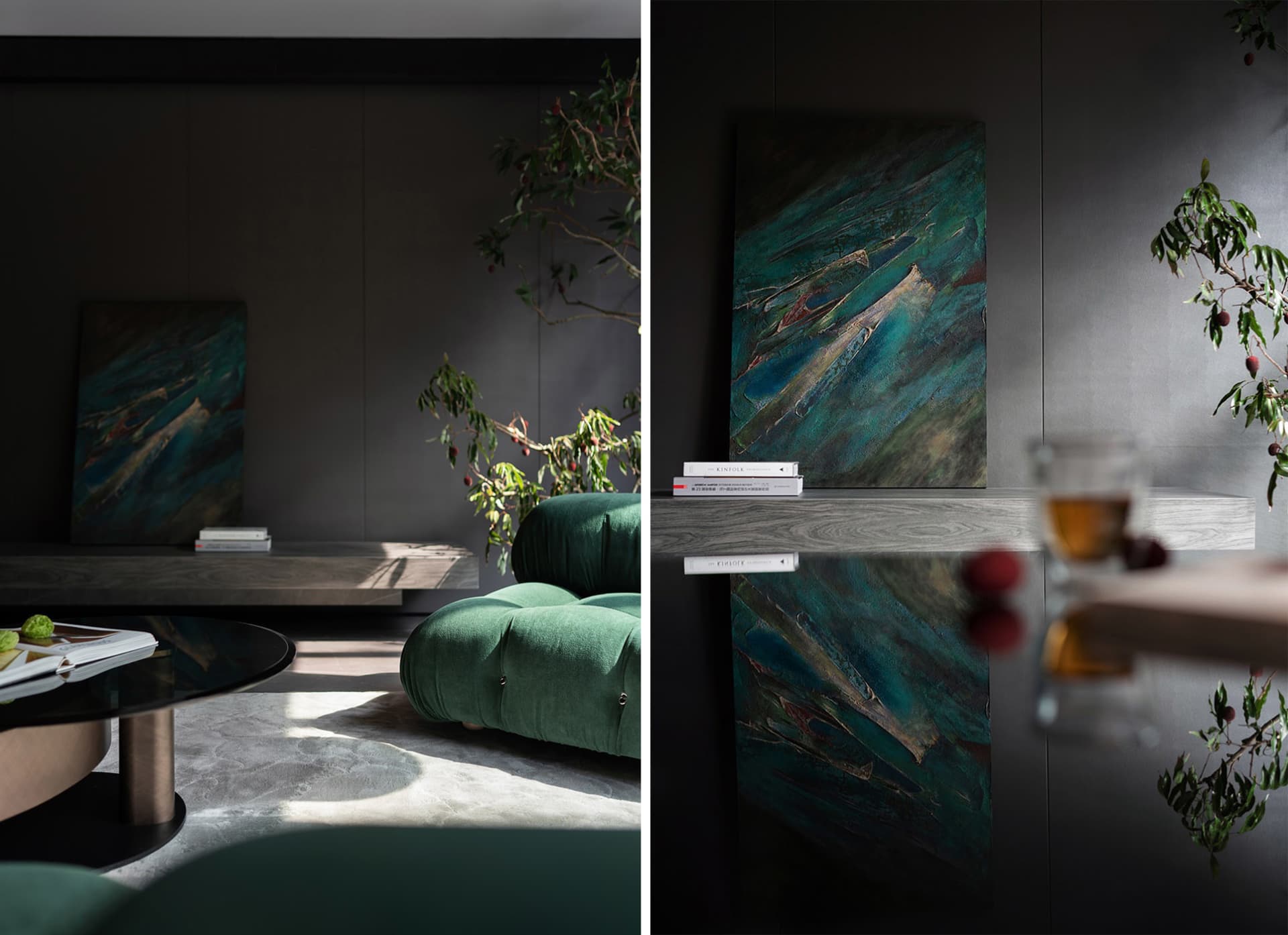 Modern living room with dark grey walls, floating wooden shelf, and green couch.