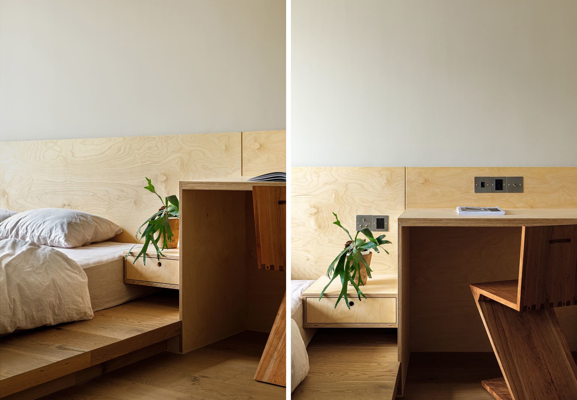 A minimalist bedroom with a wooden platform bed and built-in storage units, featuring a green plant and a desk area.