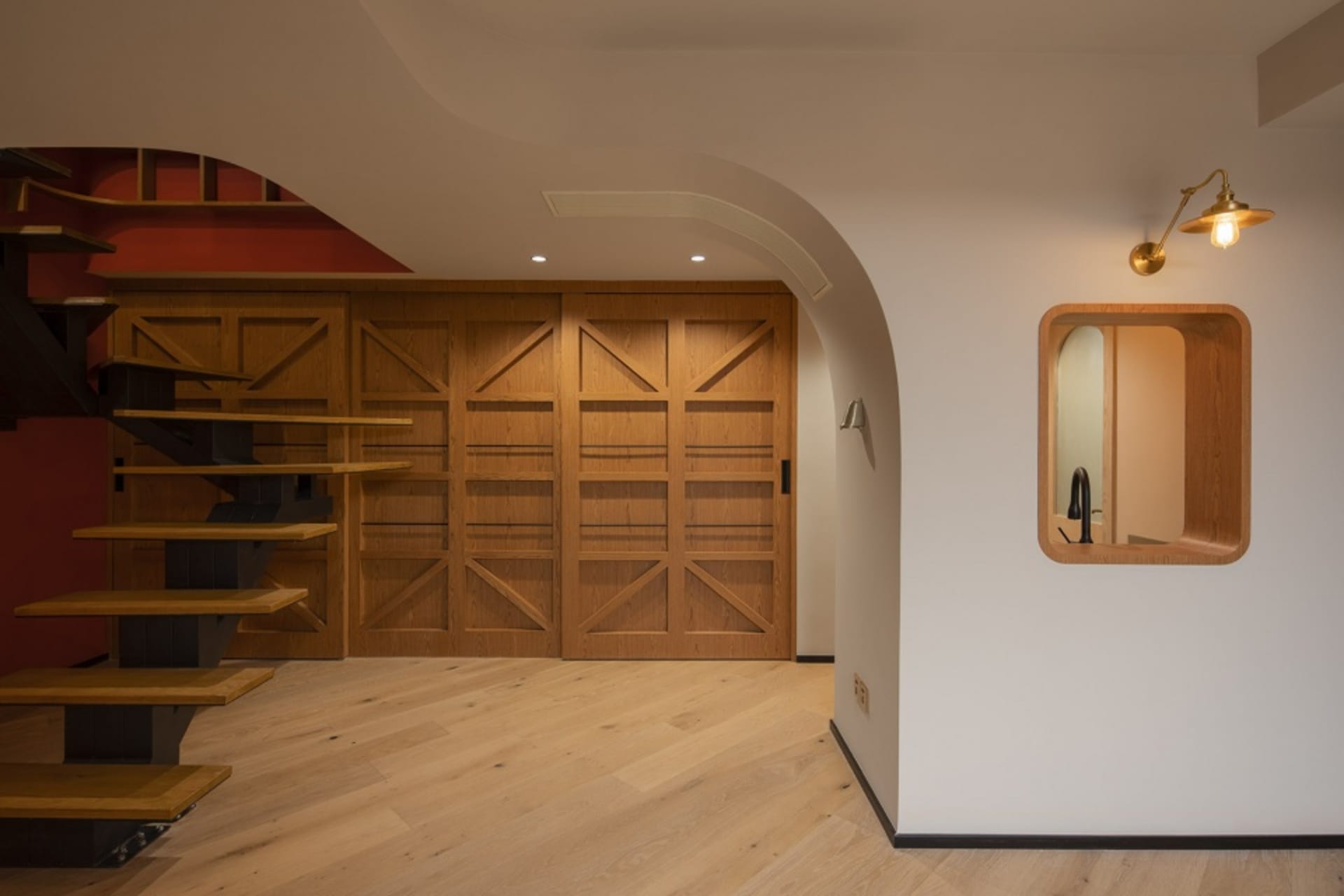 Modern interior design featuring a wooden entrance door and staircase
