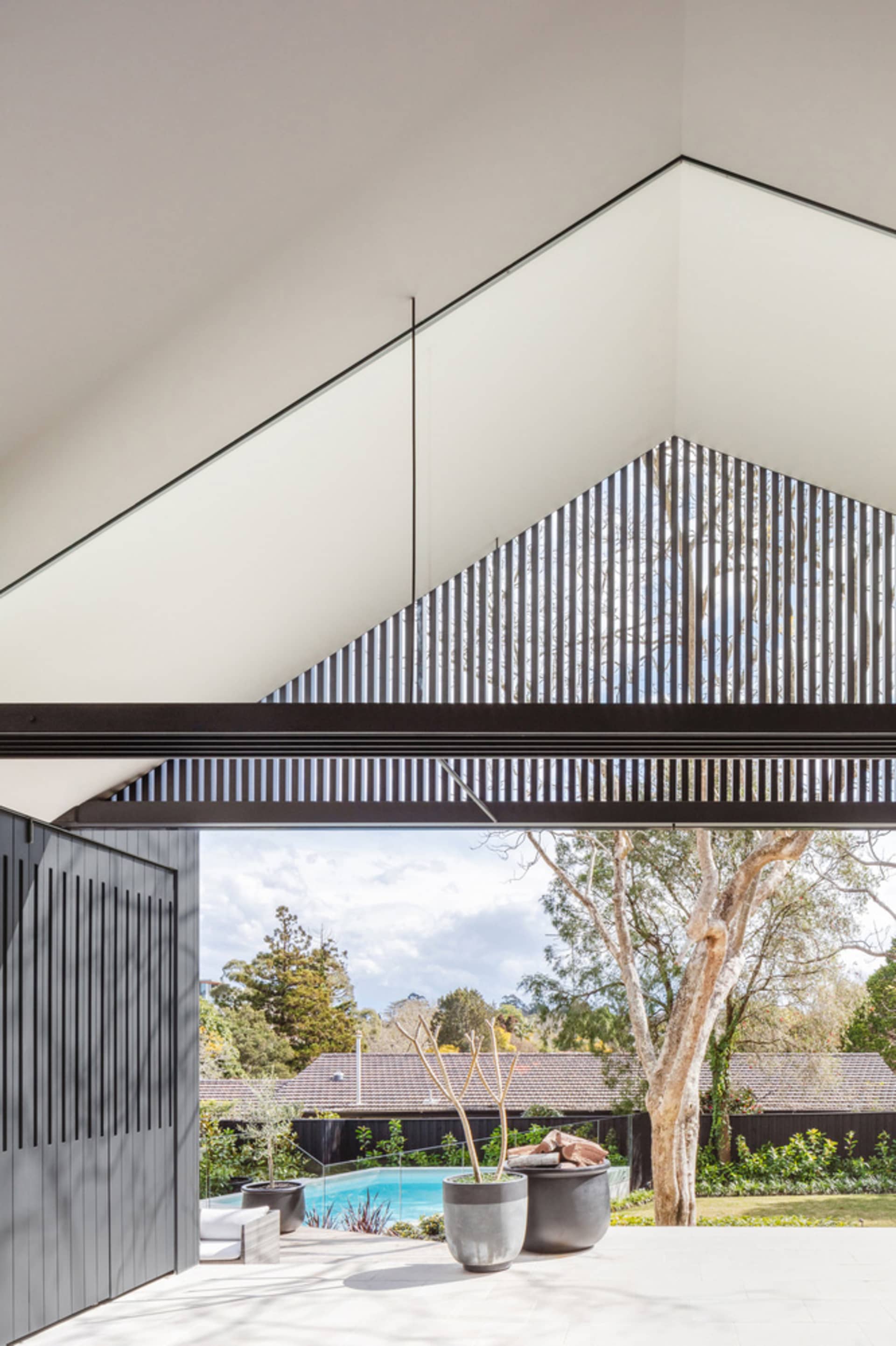 A modern exterior design featuring concrete materials and a minimalist architectural style.
