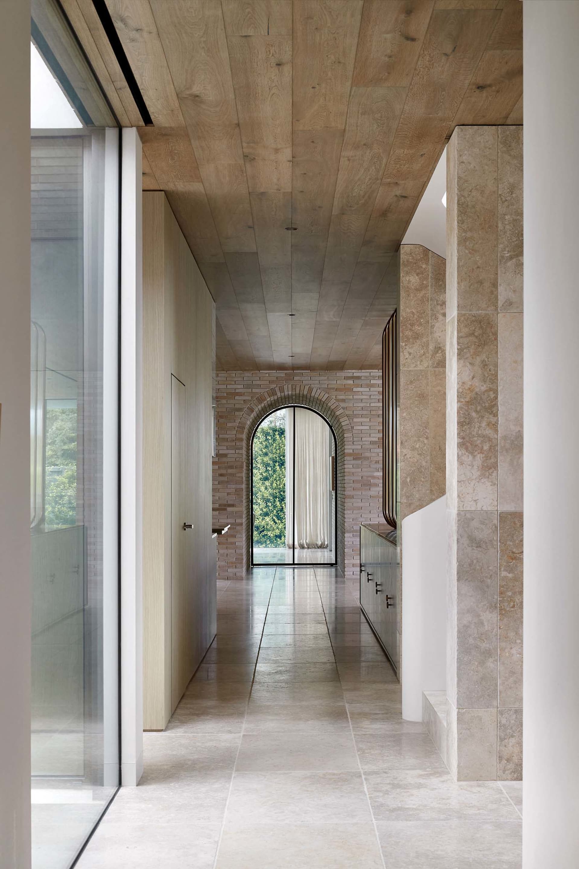 A modern interior featuring marble and wood materials.