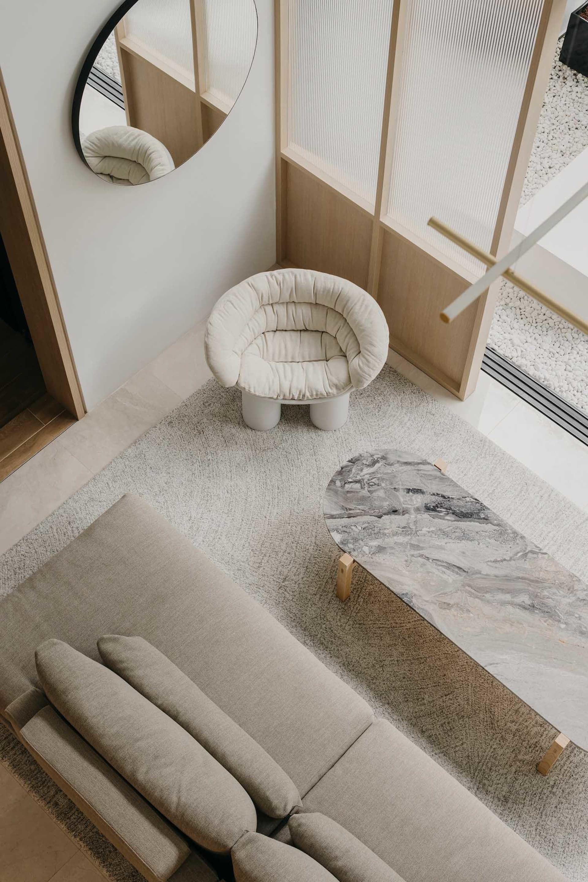 Modern living room features concrete and marble materials