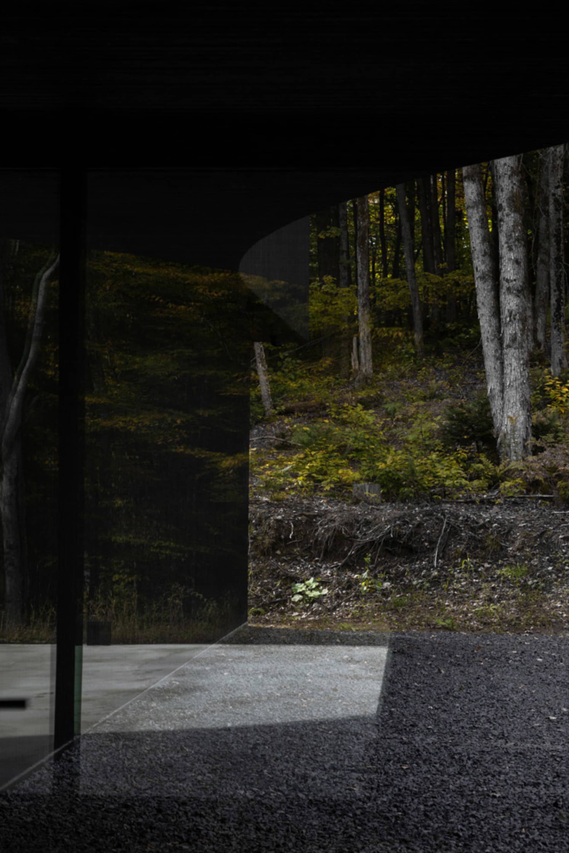 A minimalist modern architectural design featuring a glass window.